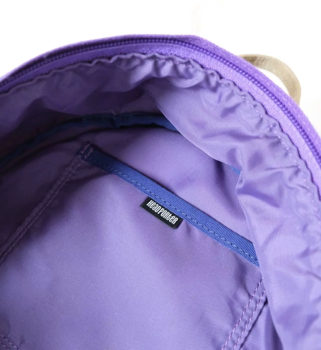 Purple Porter Canvas Backpack — label