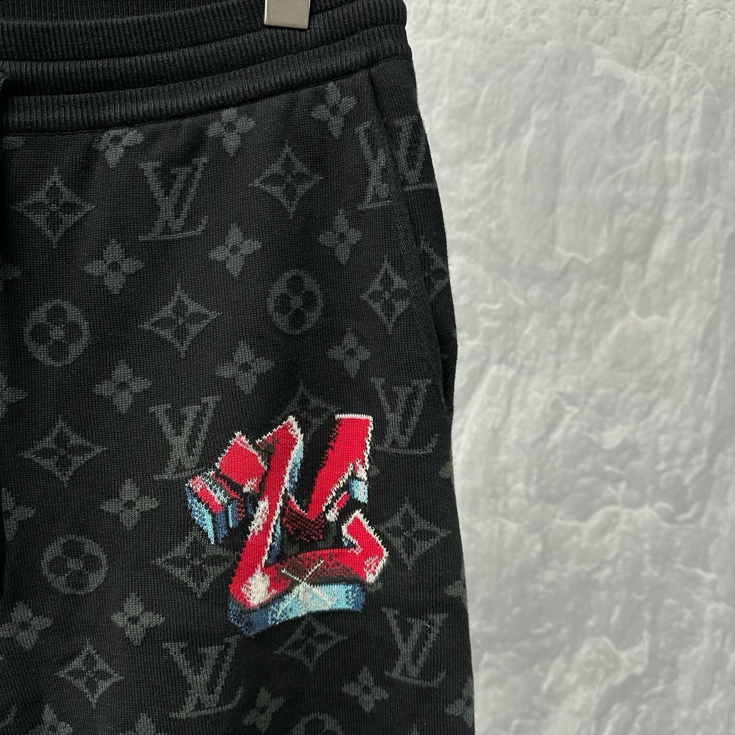 Louis Vuitton LV Logo All-Over Knit Shorts — detail