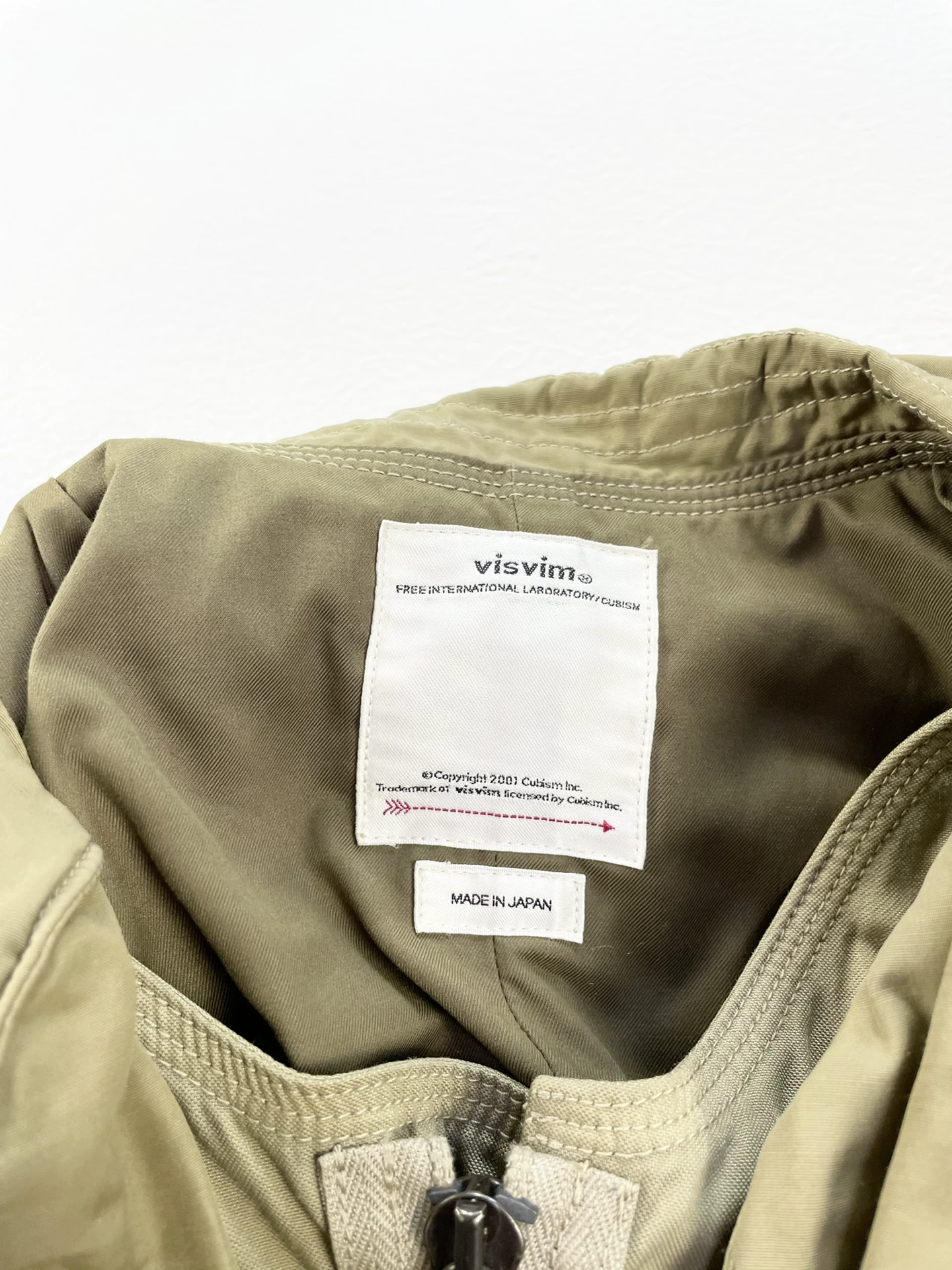 VISVIM Mud-Dyed Paratrooper Coat — label