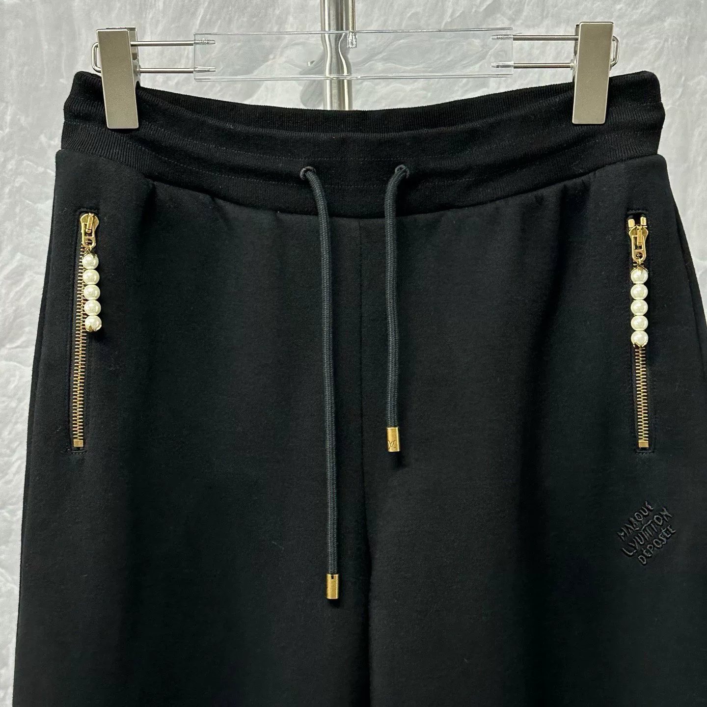 Louis Vuitton SS25 Pharrell Pearl Zip Trousers — front