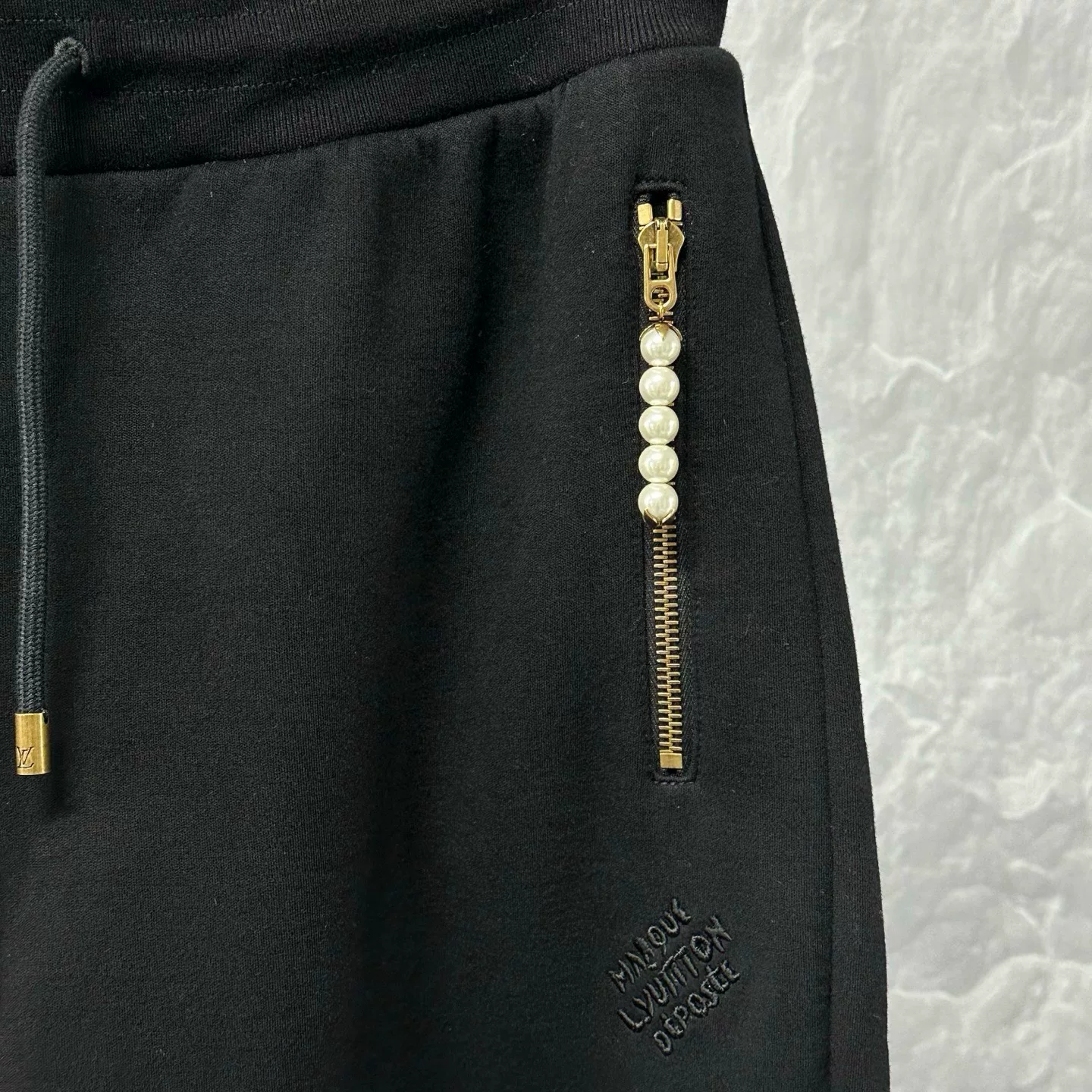 Louis Vuitton SS25 Pharrell Pearl Zip Trousers — detail