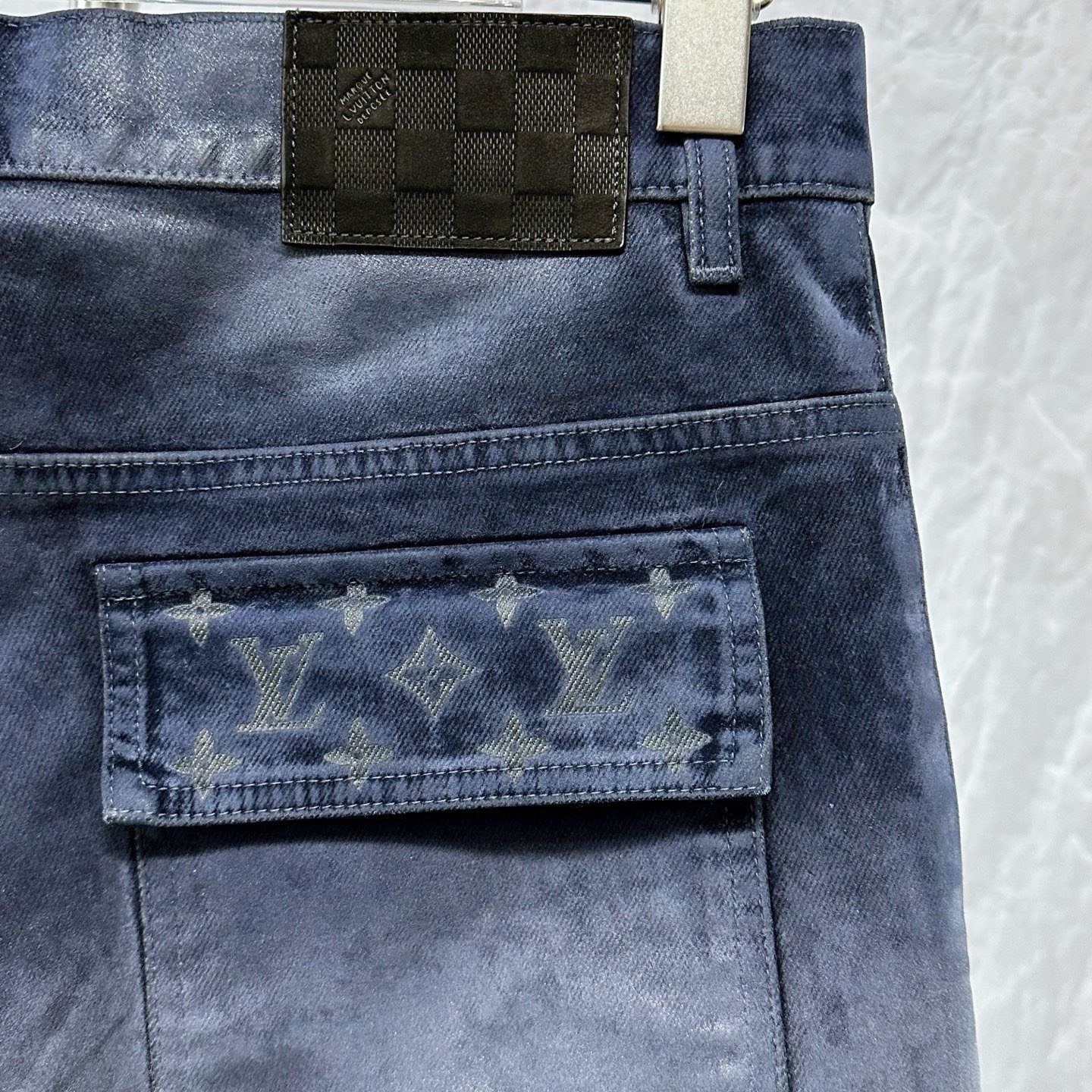 Louis Vuitton SS26 Velvet Leather Patch Denim Pants — detail
