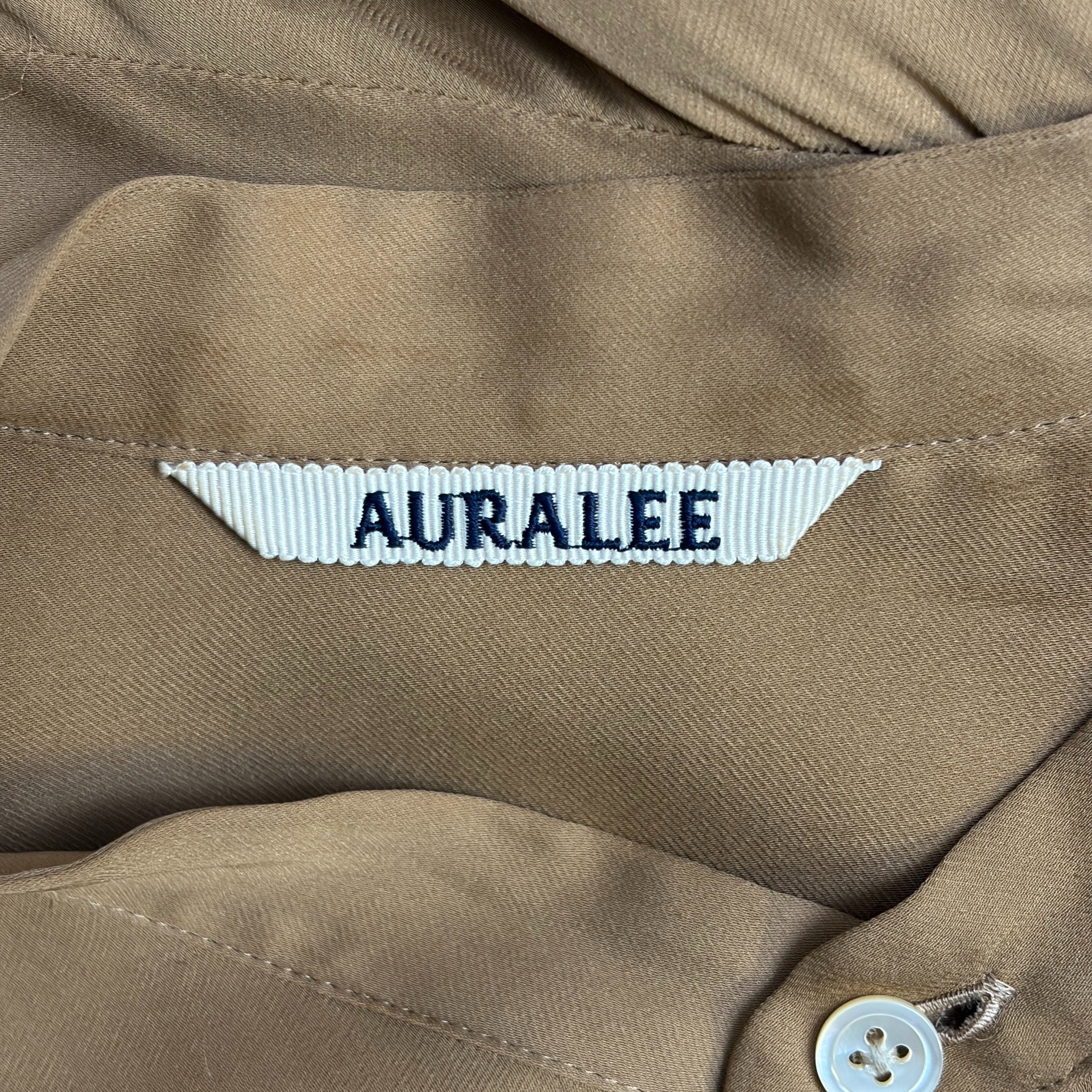 Auralee Light Camel Stand Collar Long Shirt — label
