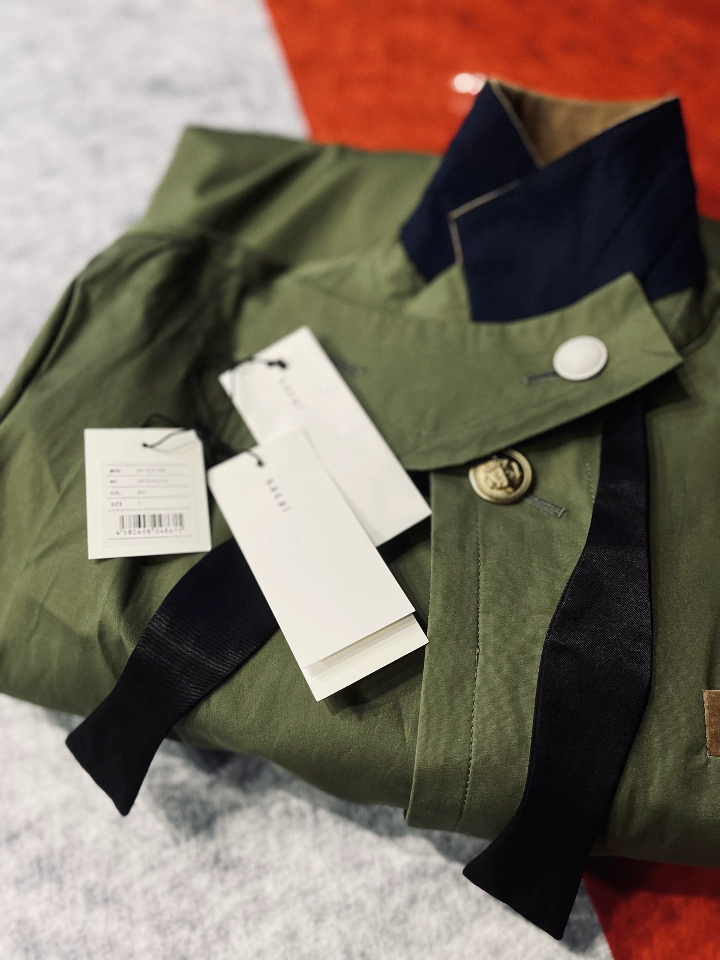 Sacai 20SS M51 Military Fishtail Coat — label