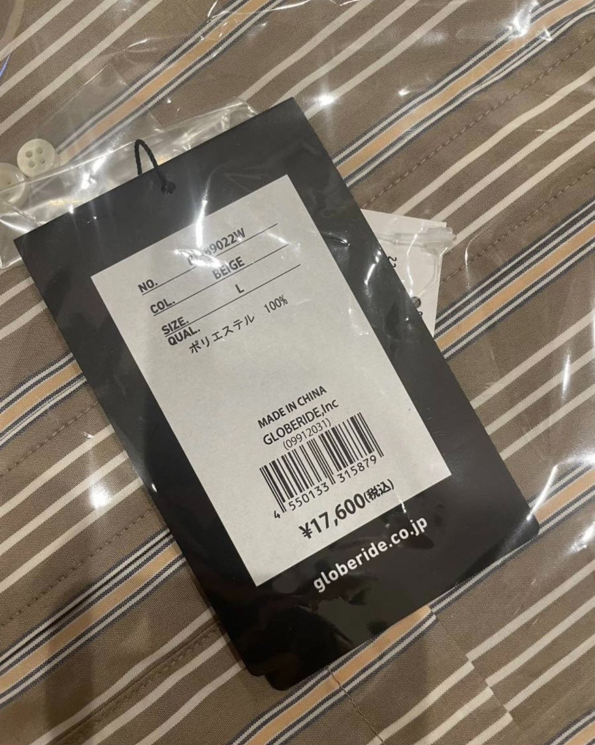 DAIWA PIER39 Tech Stripe Shirt — label