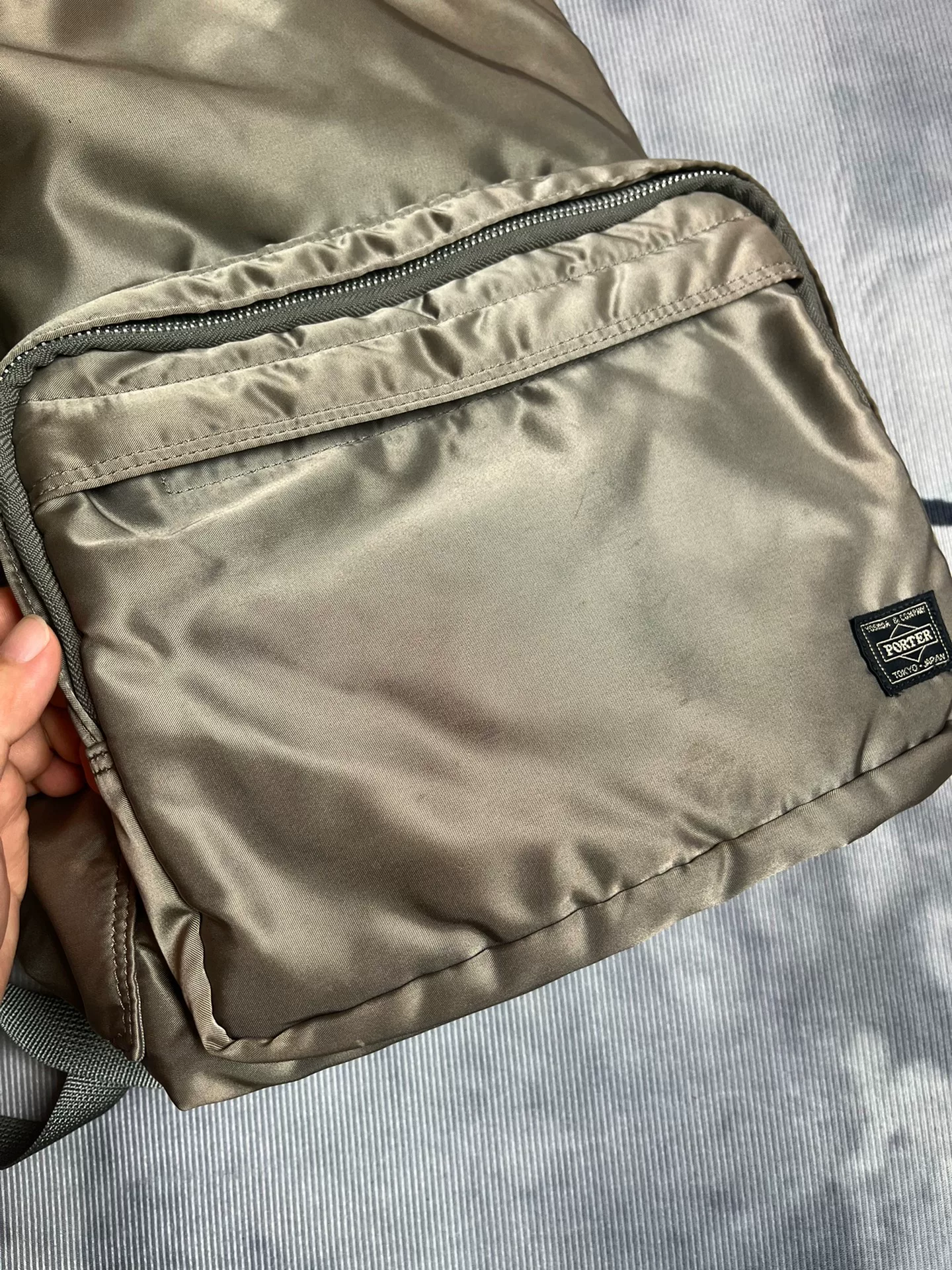 Silver-gray Porter Tanker Backpack — label