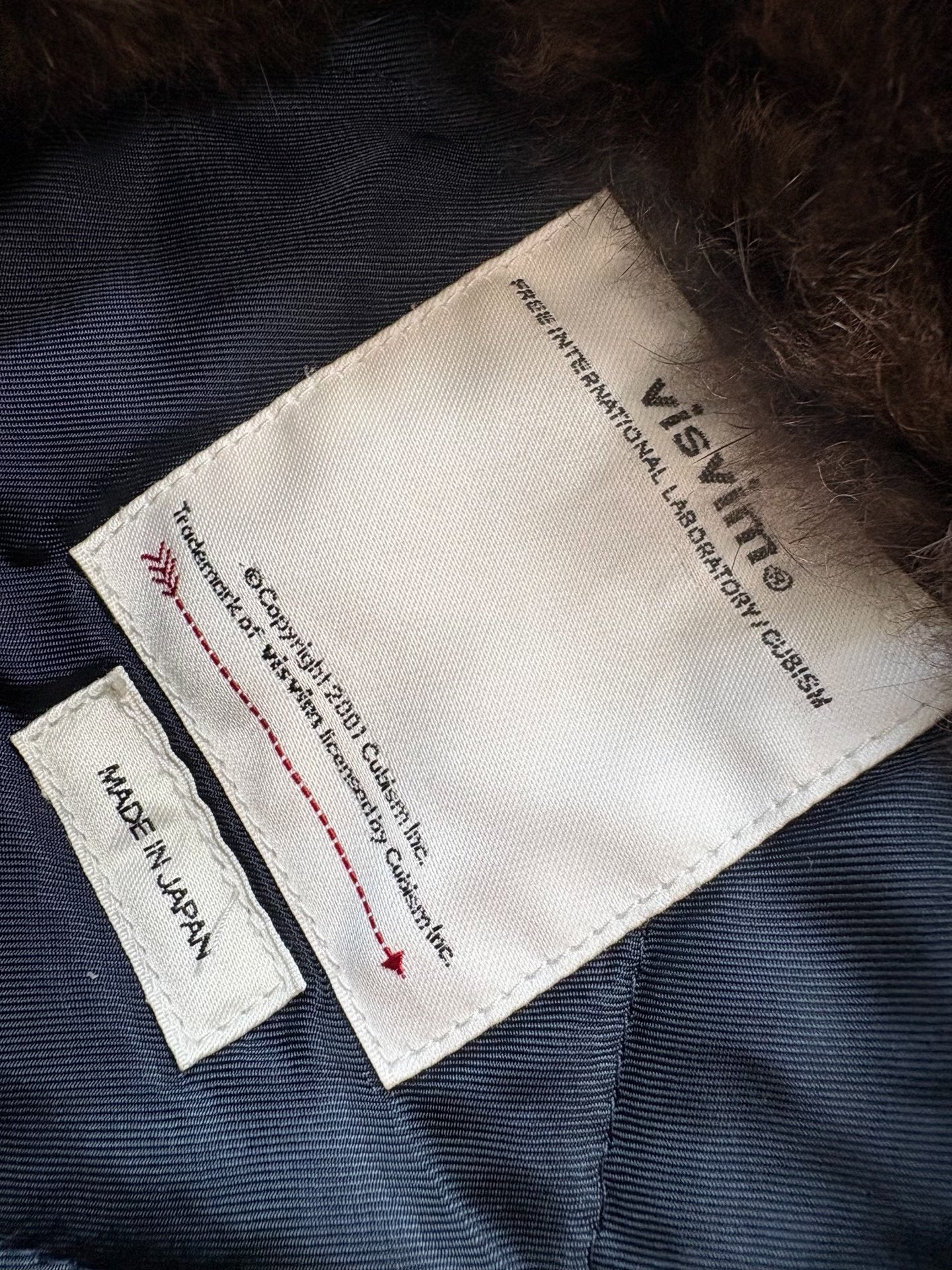VISVIM Chief Deckhand Coat with Fur Collar — label
