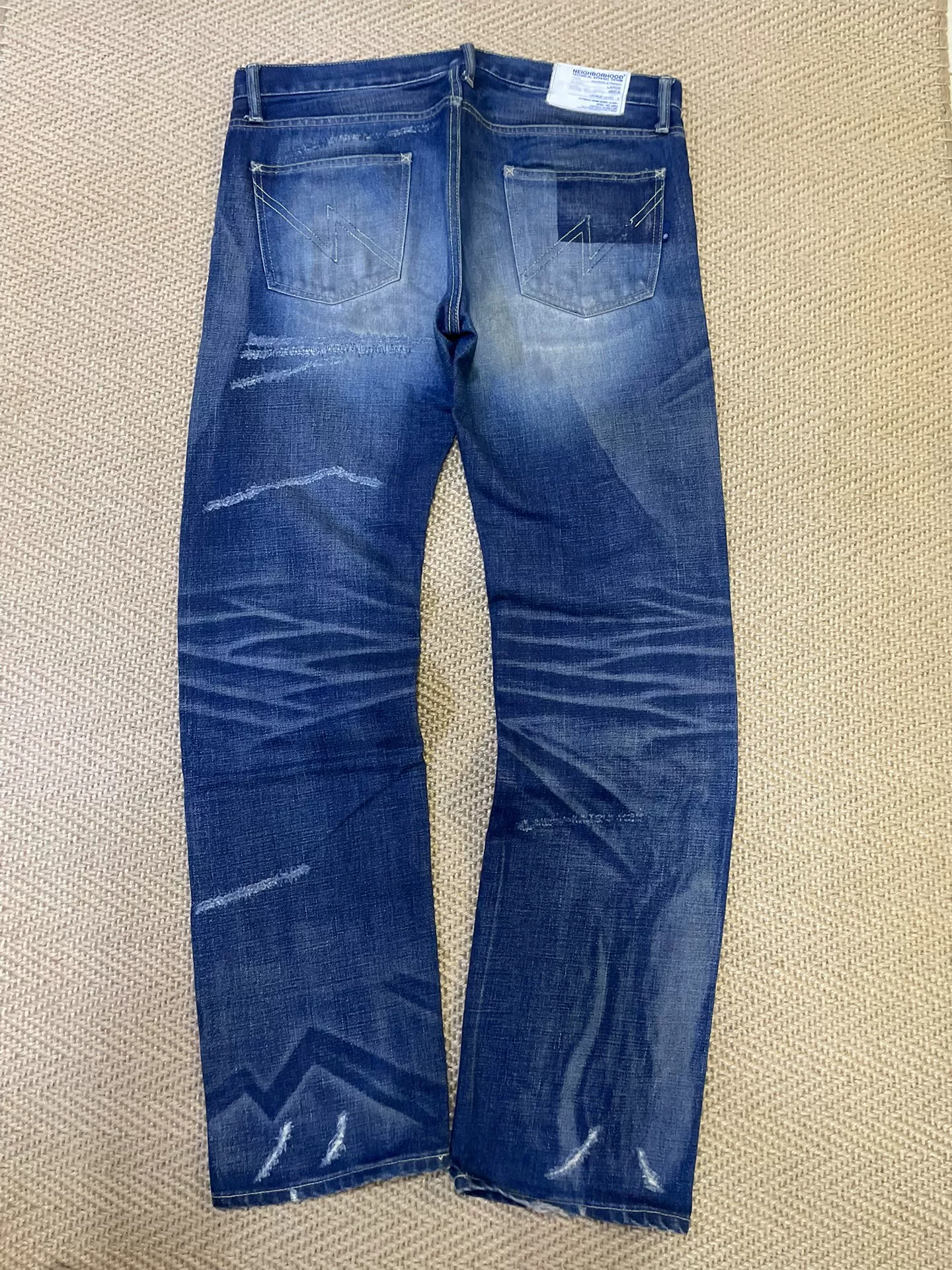 NEIGHBORHOOD Washed Distressed Jeans — front