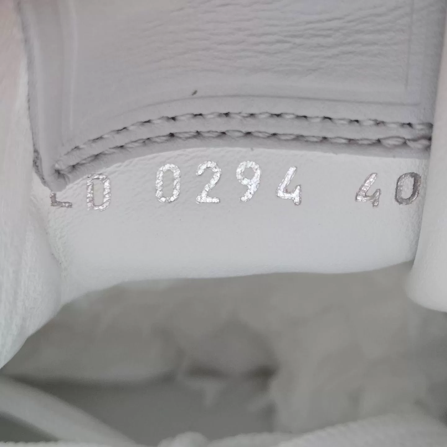 Louis Vuitton Gray White Embossed Sneakers — label