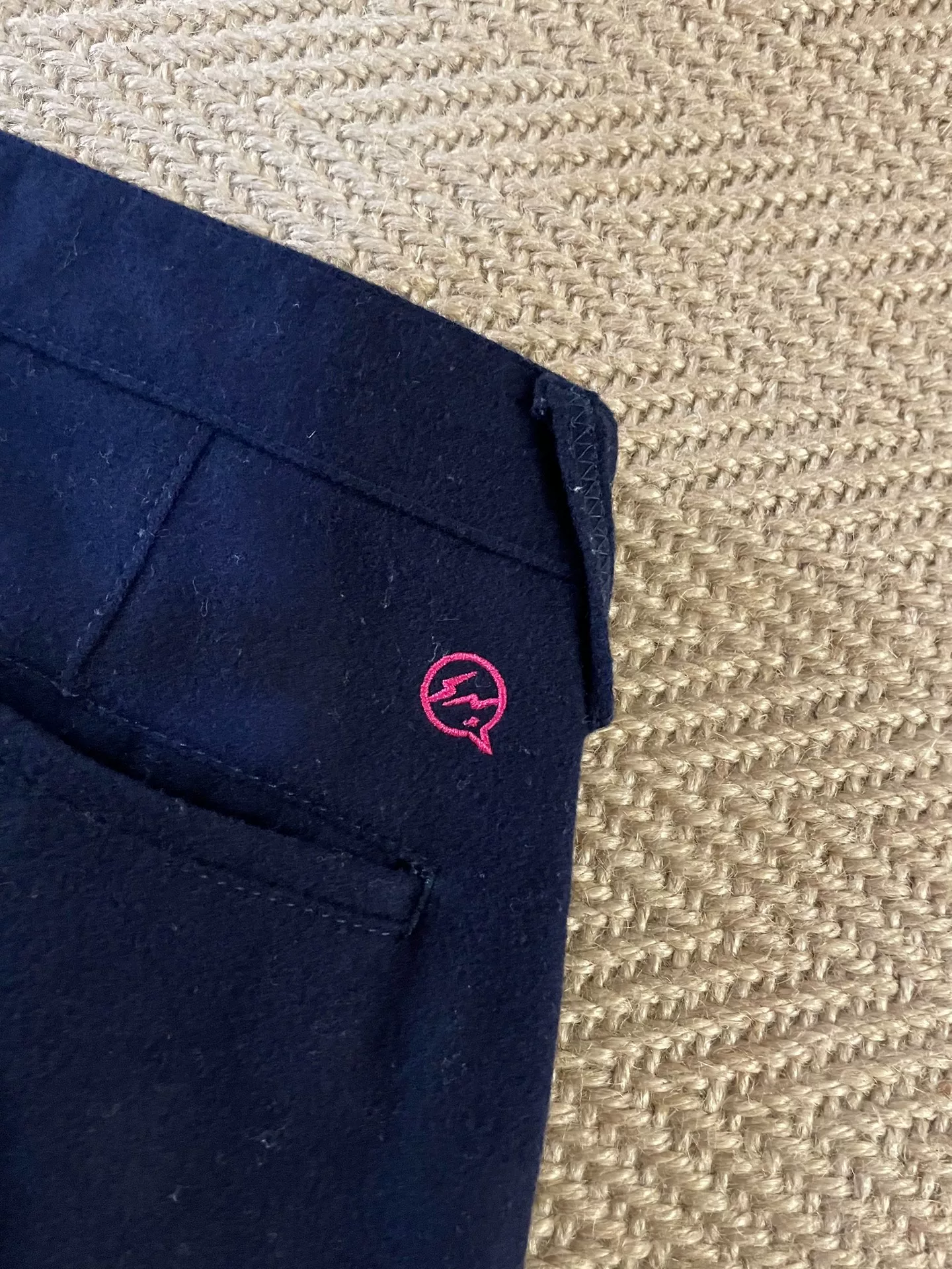 DENIM BY VANQUISH & FRAGMENT Pink Shimmer Wool Pants — label
