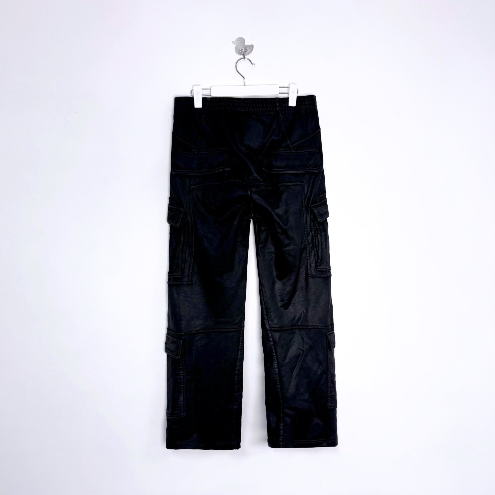 Balenciaga SS26 Waxed Biker Cargo Pants — front