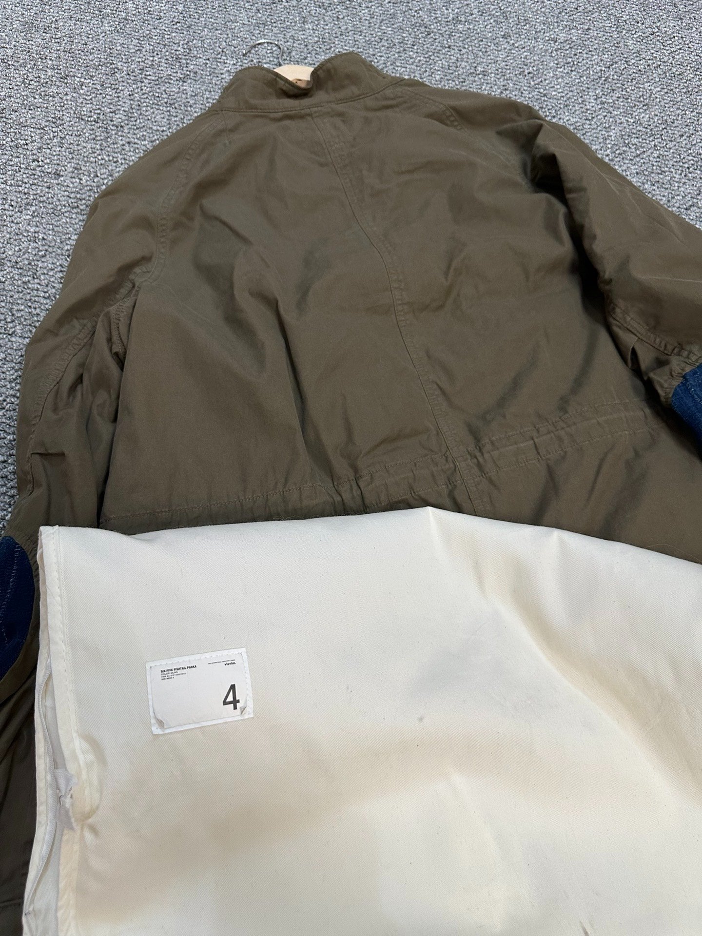 visvim six five mud-dyed patchwork coat — label