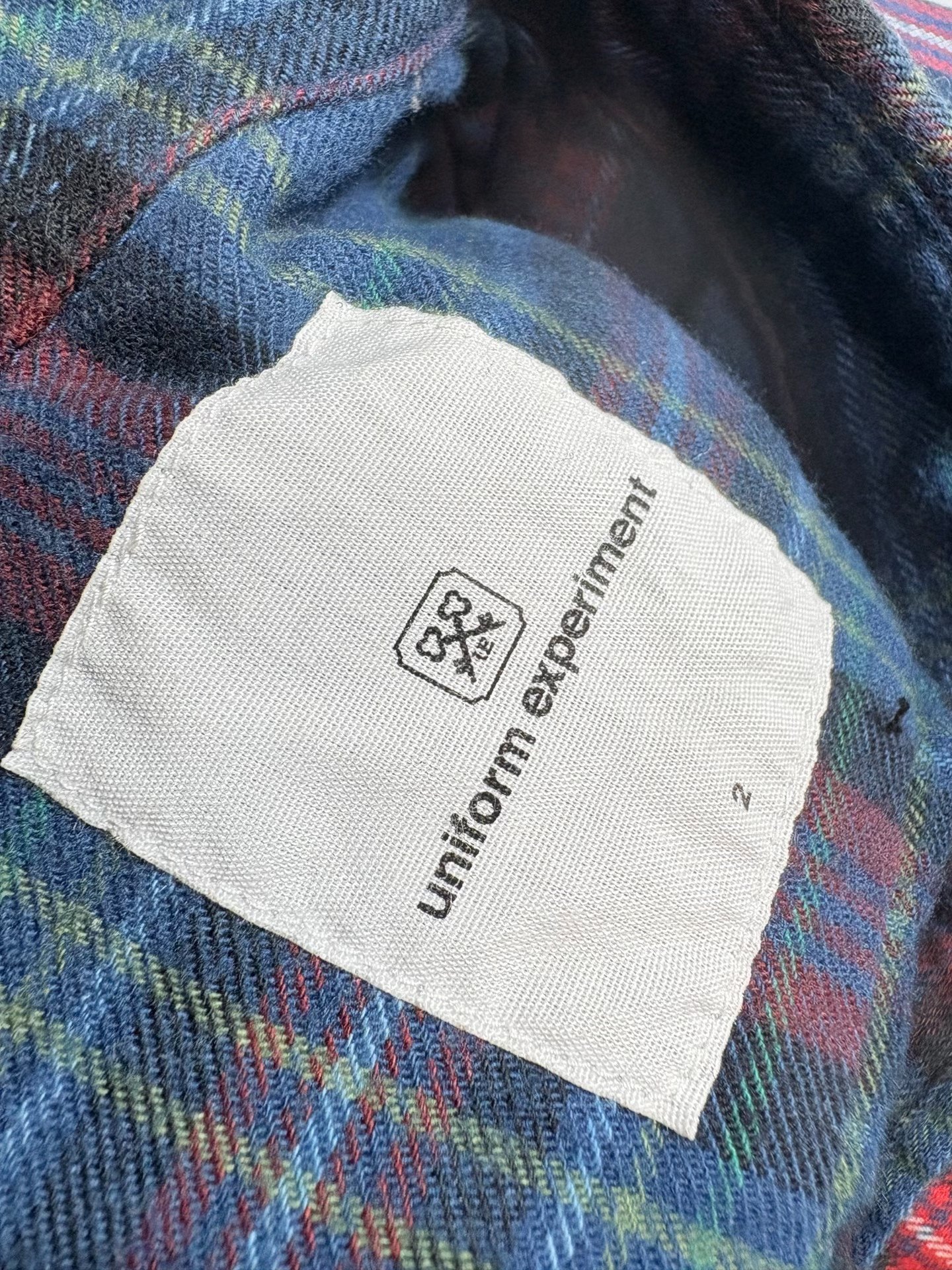 UE UNIFORM EXPERIMENT Tie-Dye Plaid Shirt — label