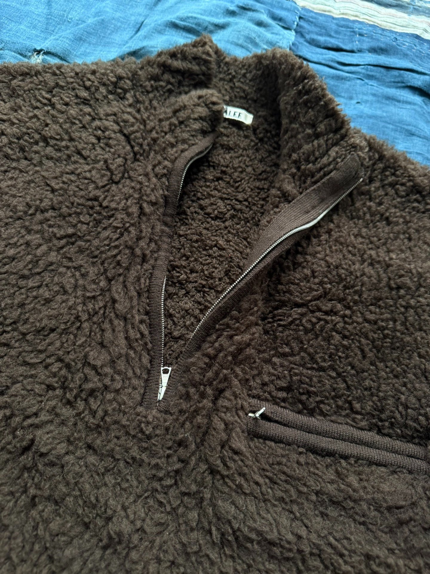 AURALEE Boa Knit Half-Zip Sweater Jacket — label