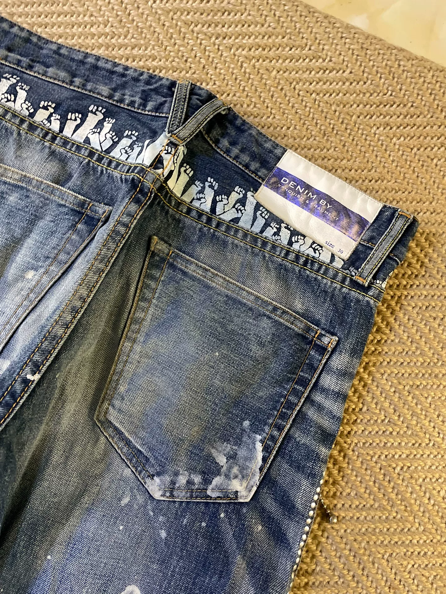 Vanquish Fragment Distressed Splatter Jeans — label