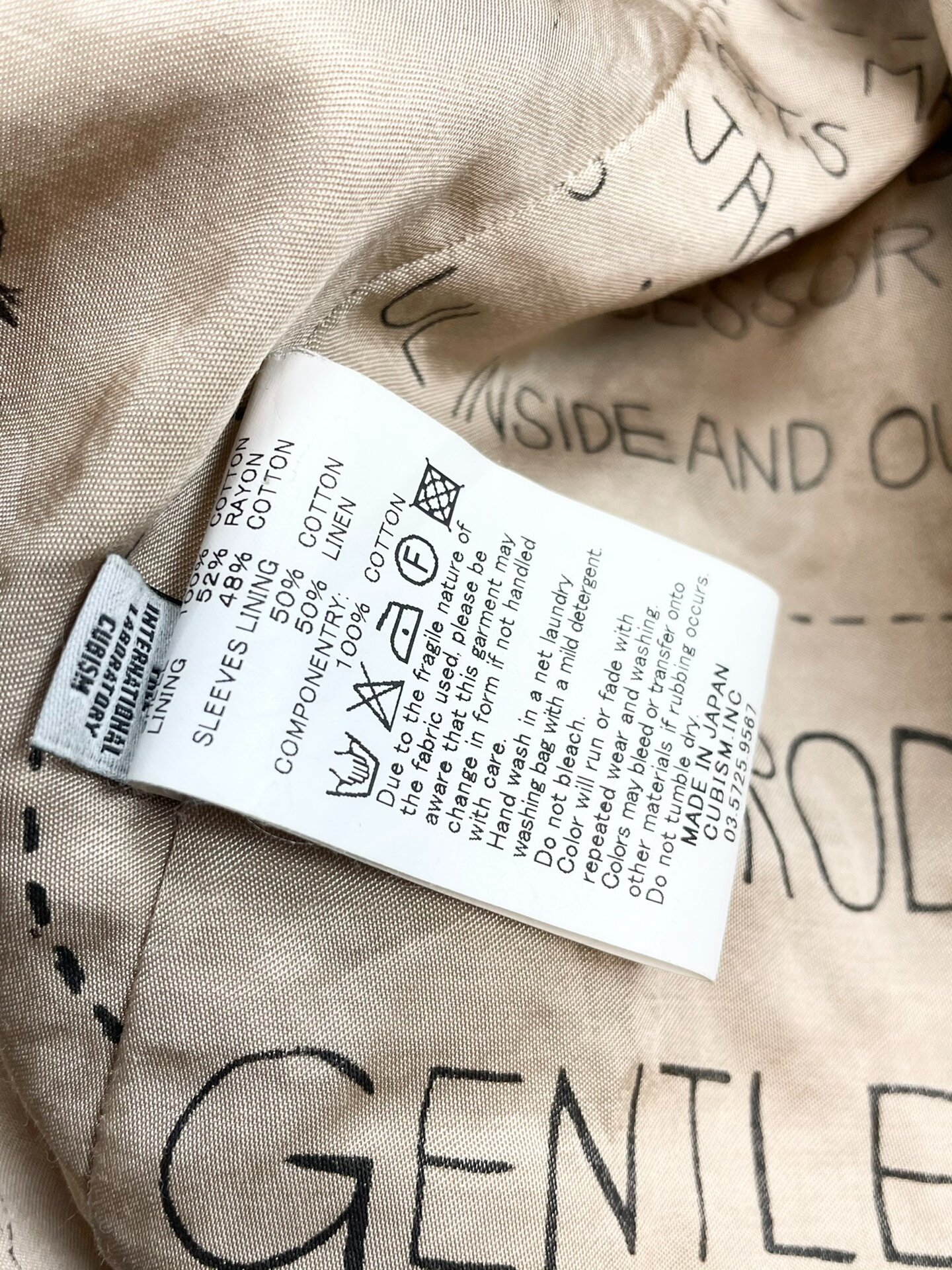 VISVIM Shipman Distressed Trench Coat — label