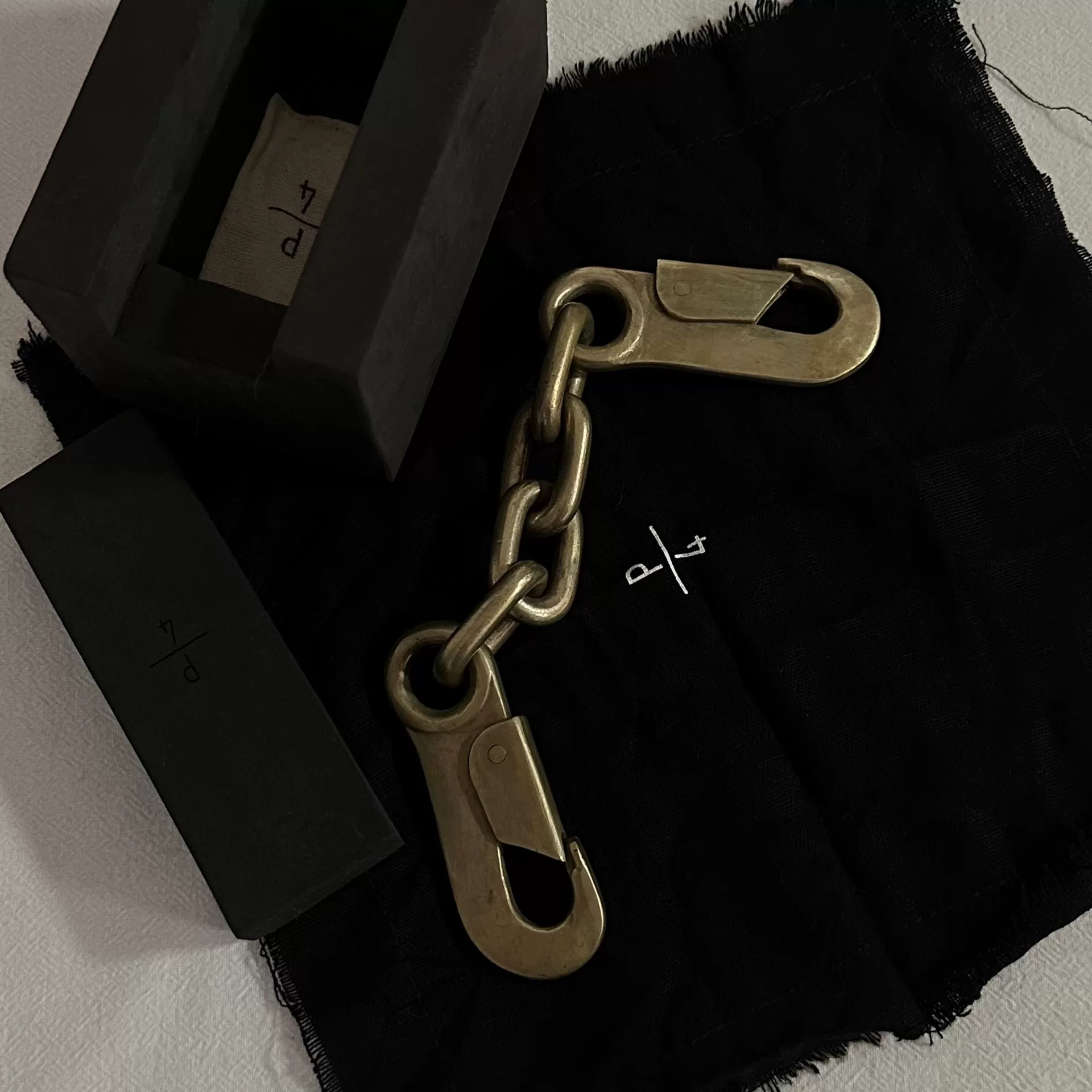 Parts of Four P/4 Solid Brass Double Hook Chain — detail