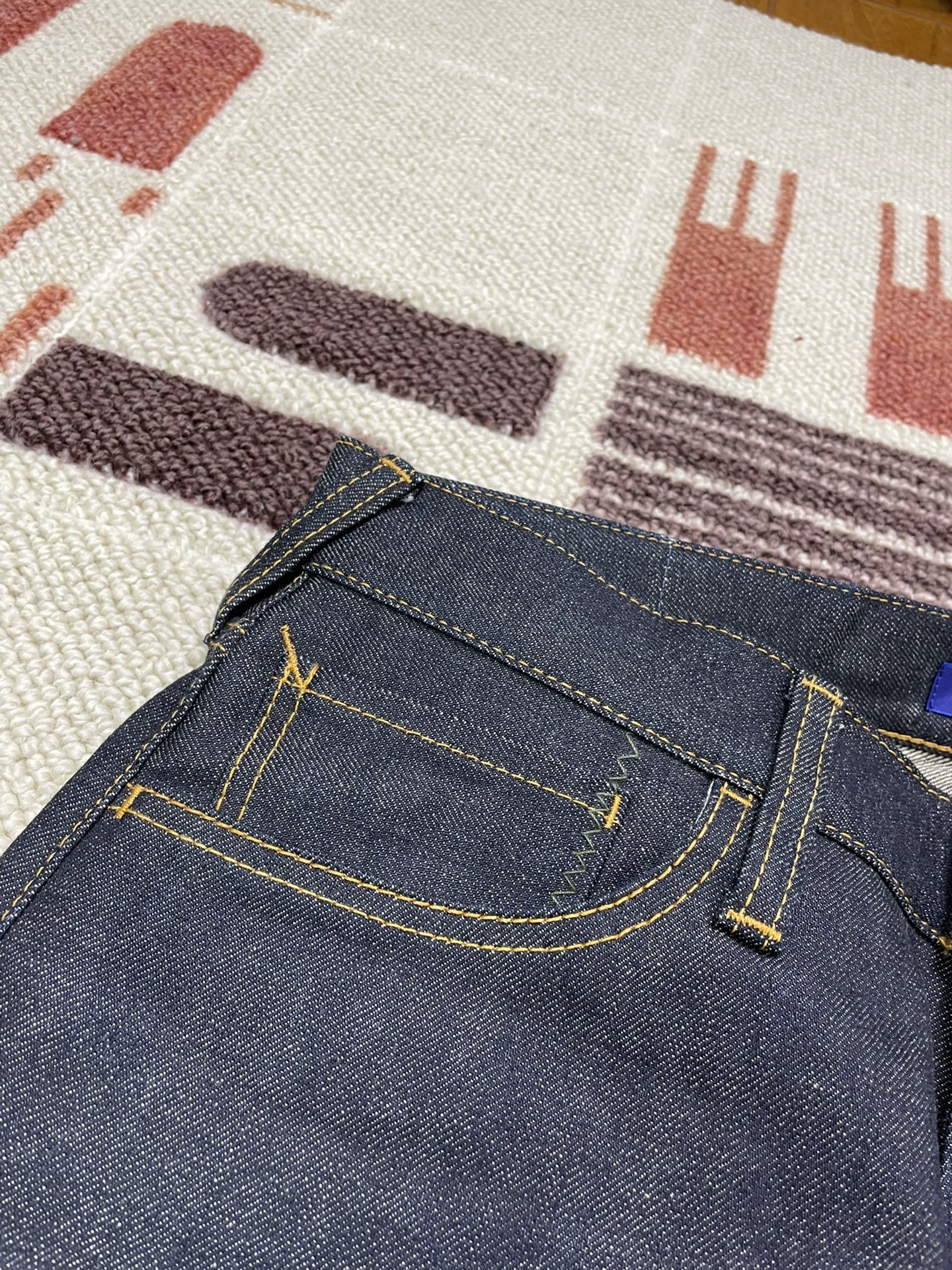 Vanquish & Fragment Orange Flash Denim Jeans — label