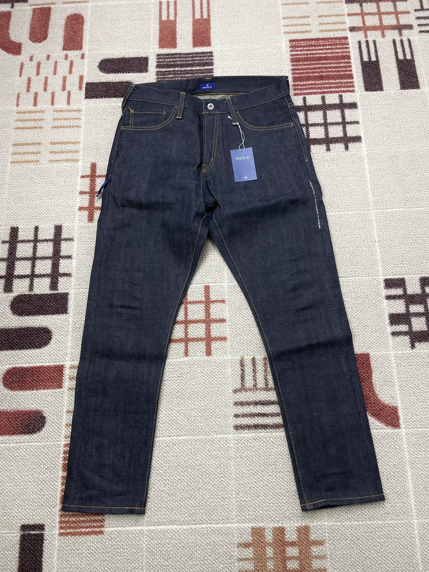 Vanquish & Fragment Orange Flash Denim Jeans — front