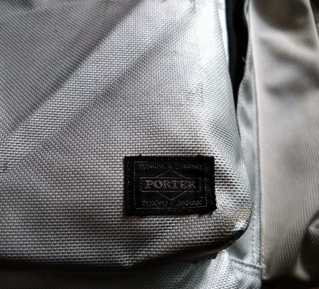 Porter Gray Canvas Backpack — label