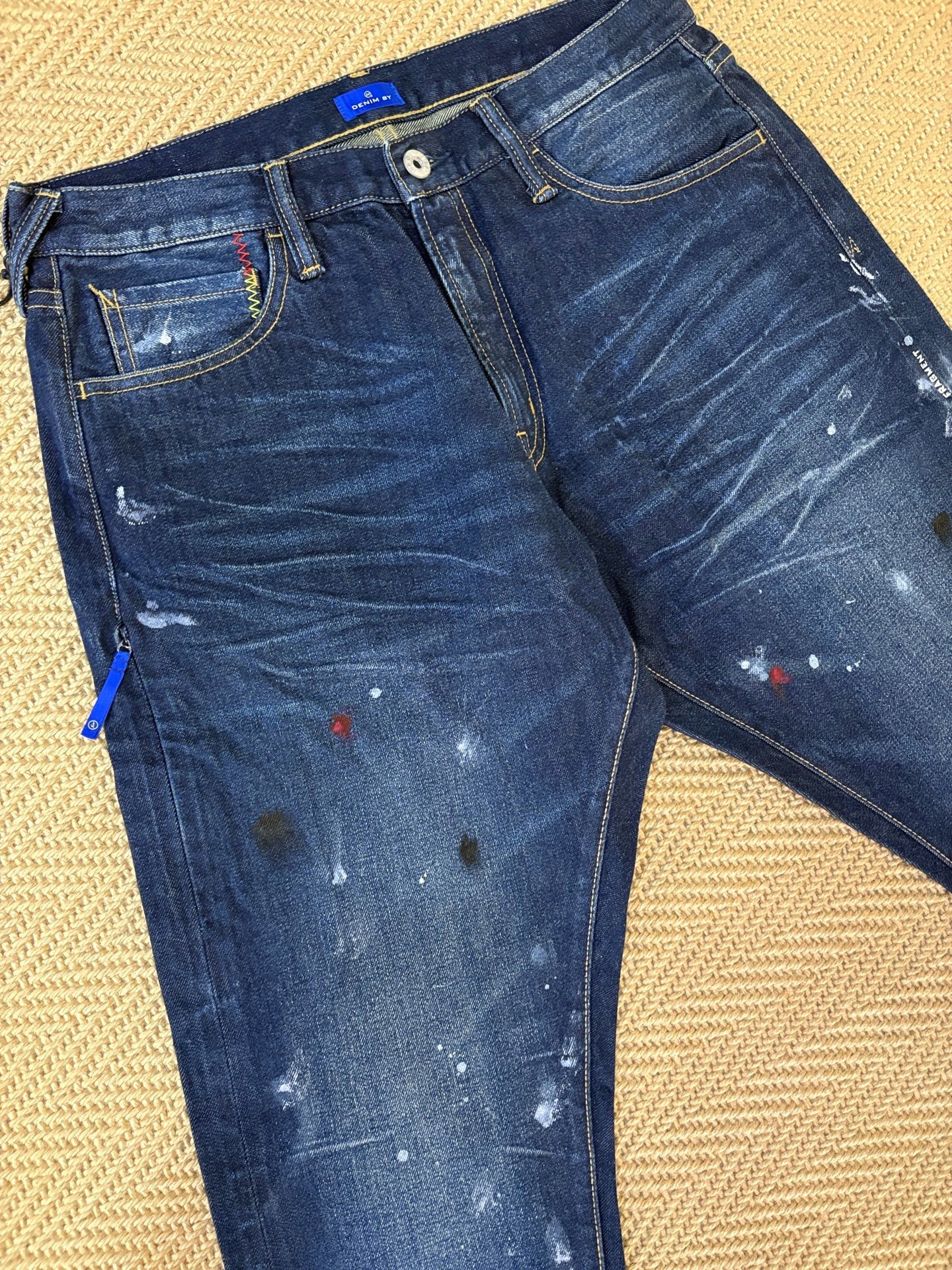 Vanquish & Fragment Lightning Splatter Jeans — label