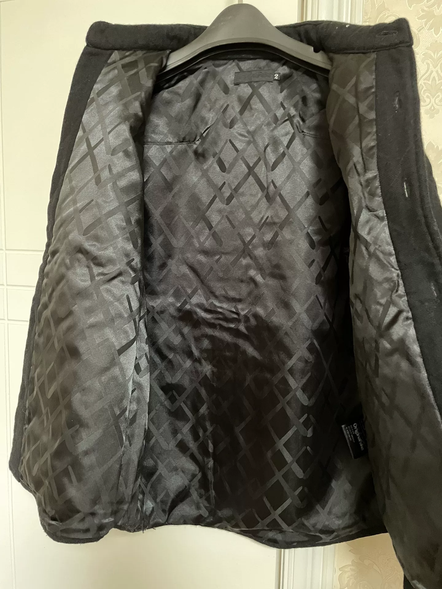 OriginalFake Early KAWS Cotton Coat — label