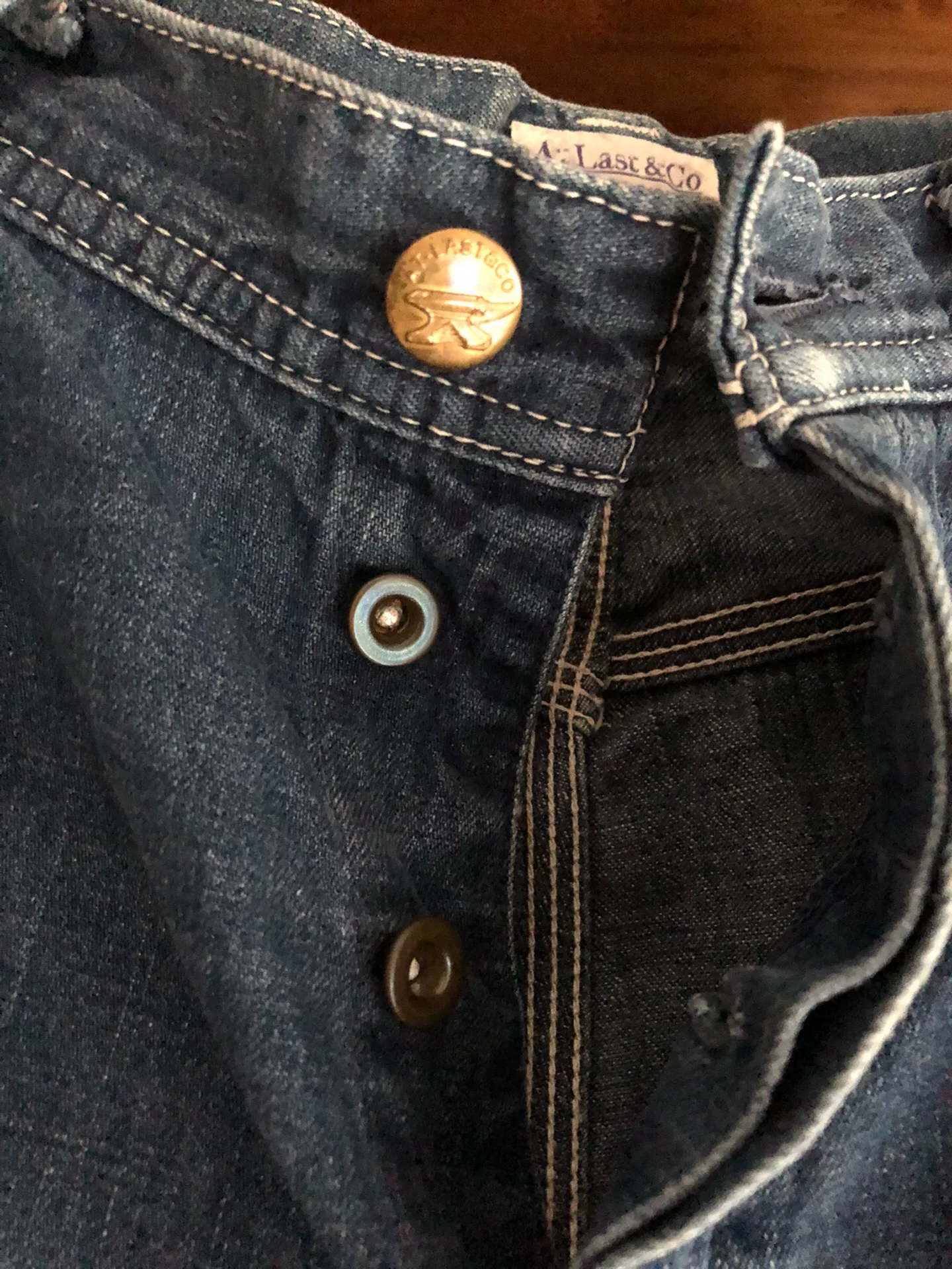 At Last Co Washed Straight Wide-Leg Jeans — label