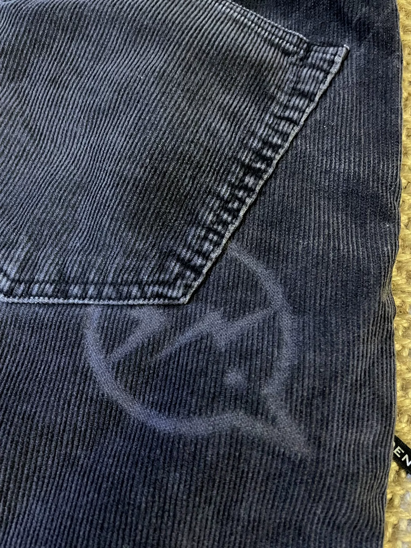 Vanquish & Fragment Distressed Corduroy Pants — label