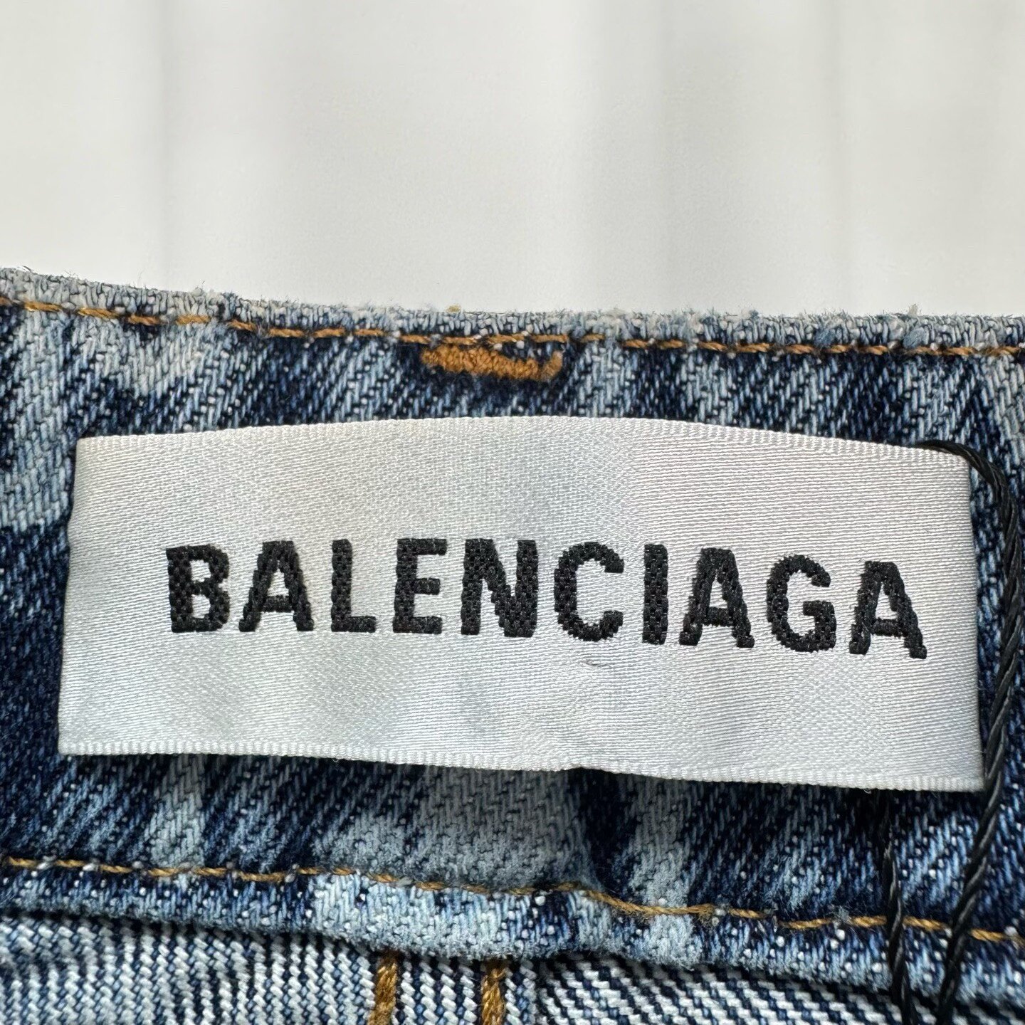 Balenciaga Cursive Lettering All-Over Jeans — label