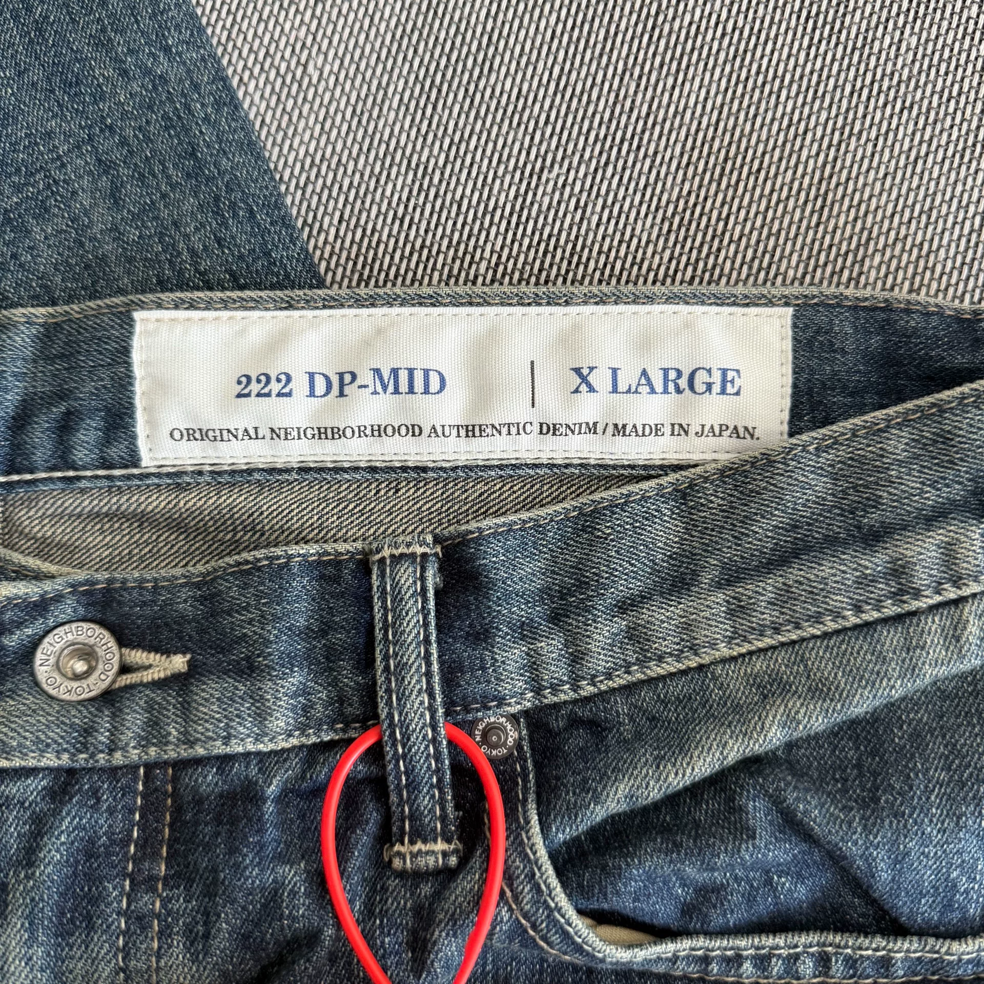 Neighborhood 22AW Washed Jeans — label