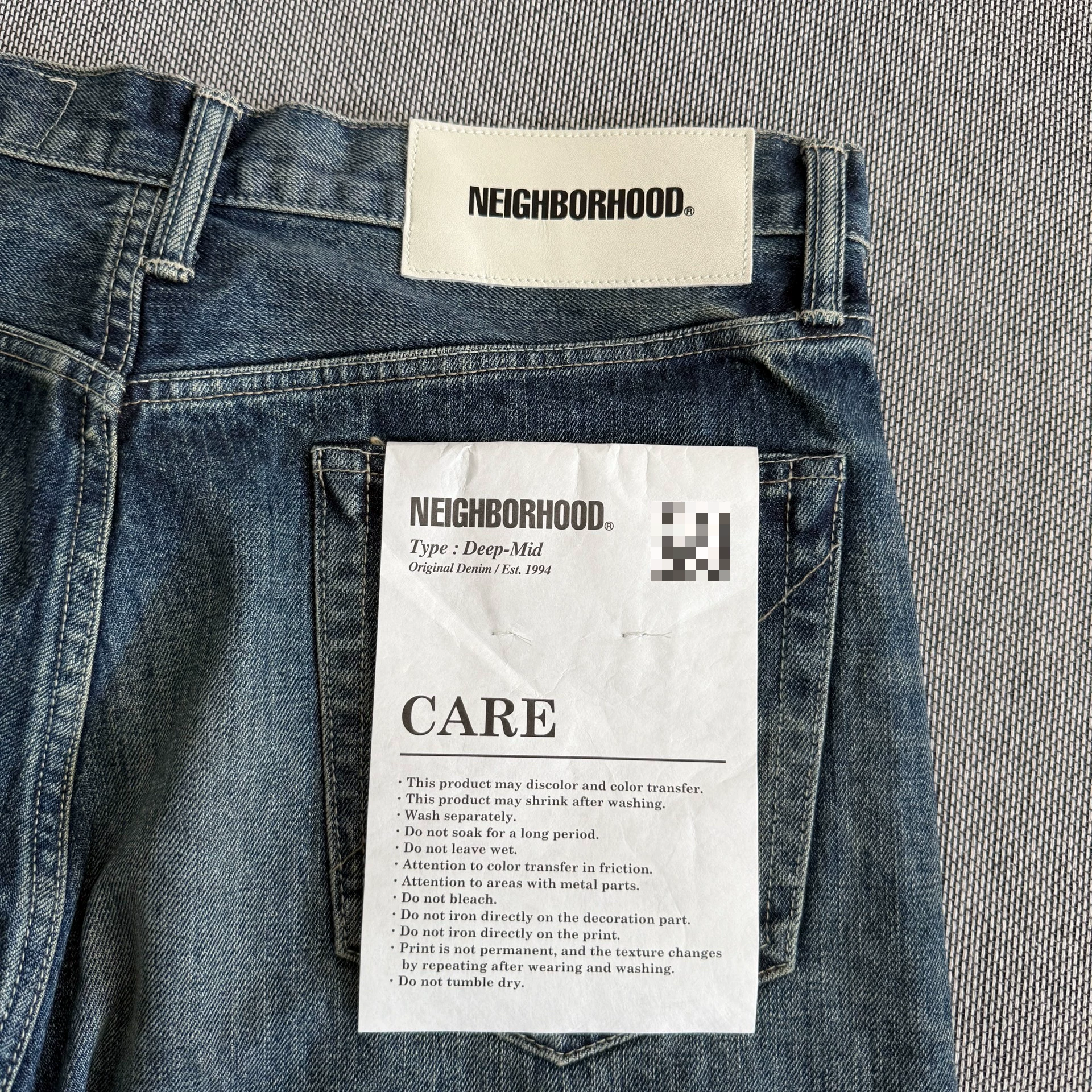 Neighborhood 22AW Washed Jeans — back