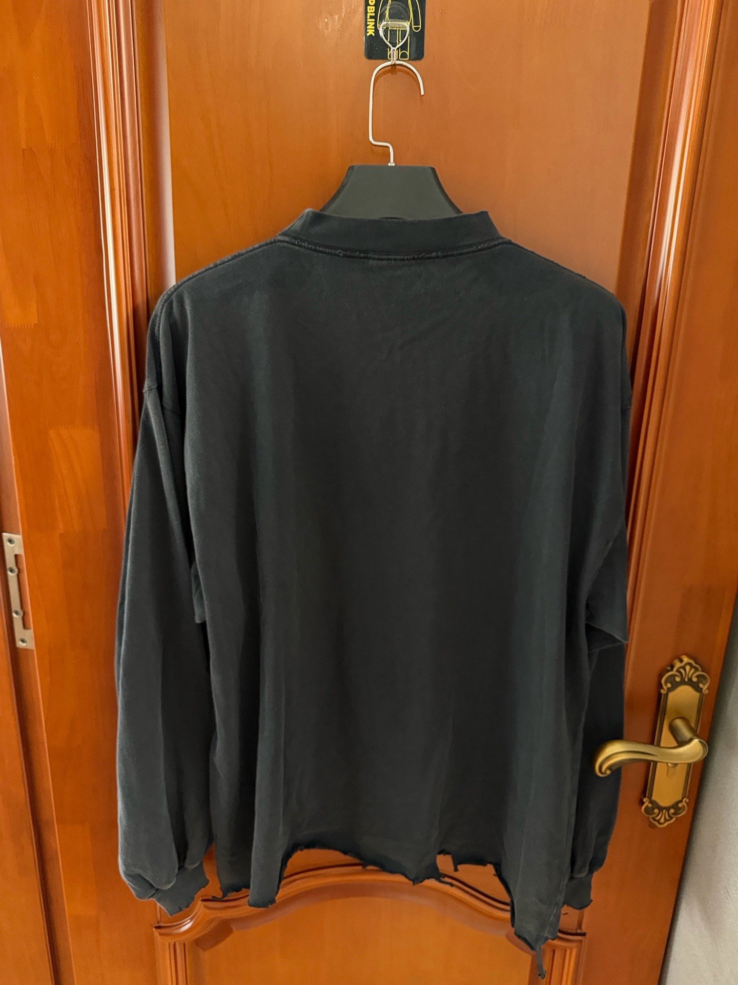Balenciaga Distressed Embossed Logo Long Sleeve T-Shirt — front