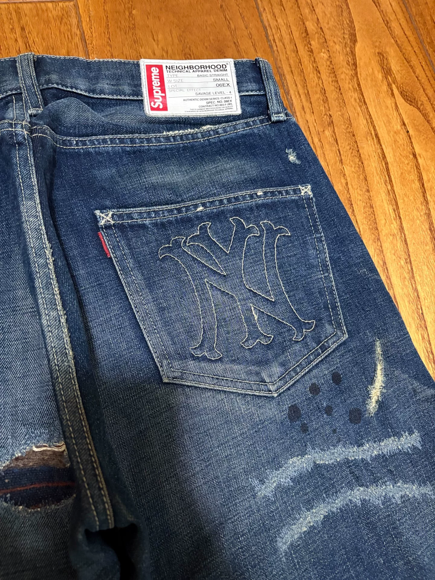 Neighborhood x Supreme Distressed Patch Washed Jeans — label