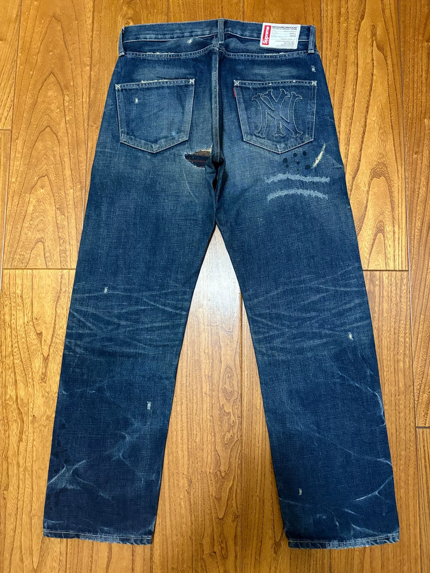 Neighborhood x Supreme Distressed Patch Washed Jeans — front