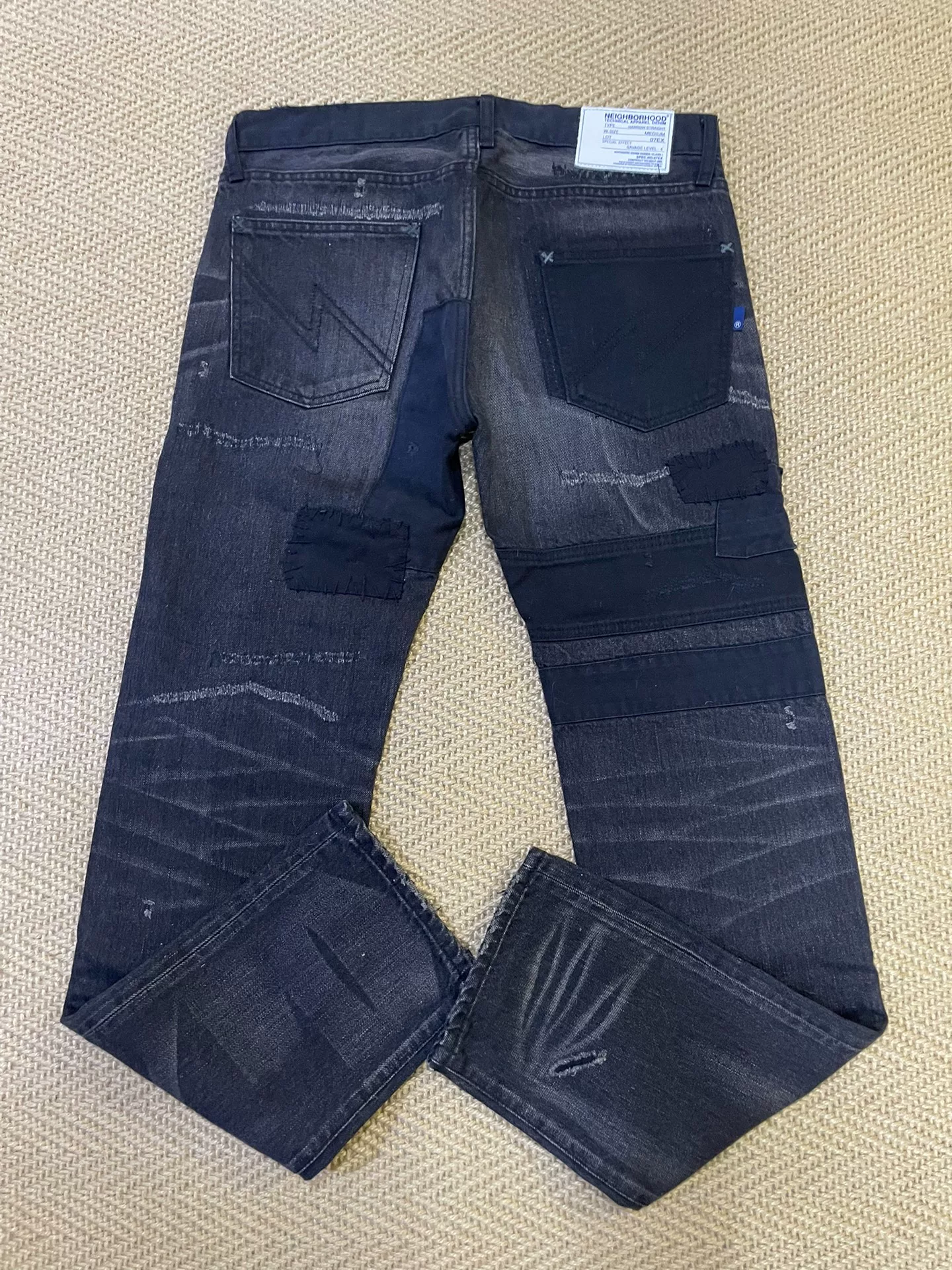 NEIGHBORHOOD 07EX Distressed Patch Jeans — front