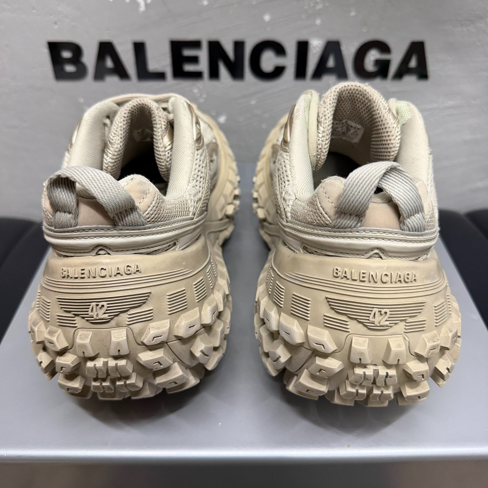 Balenciaga Defender Distressed Sneakers — label