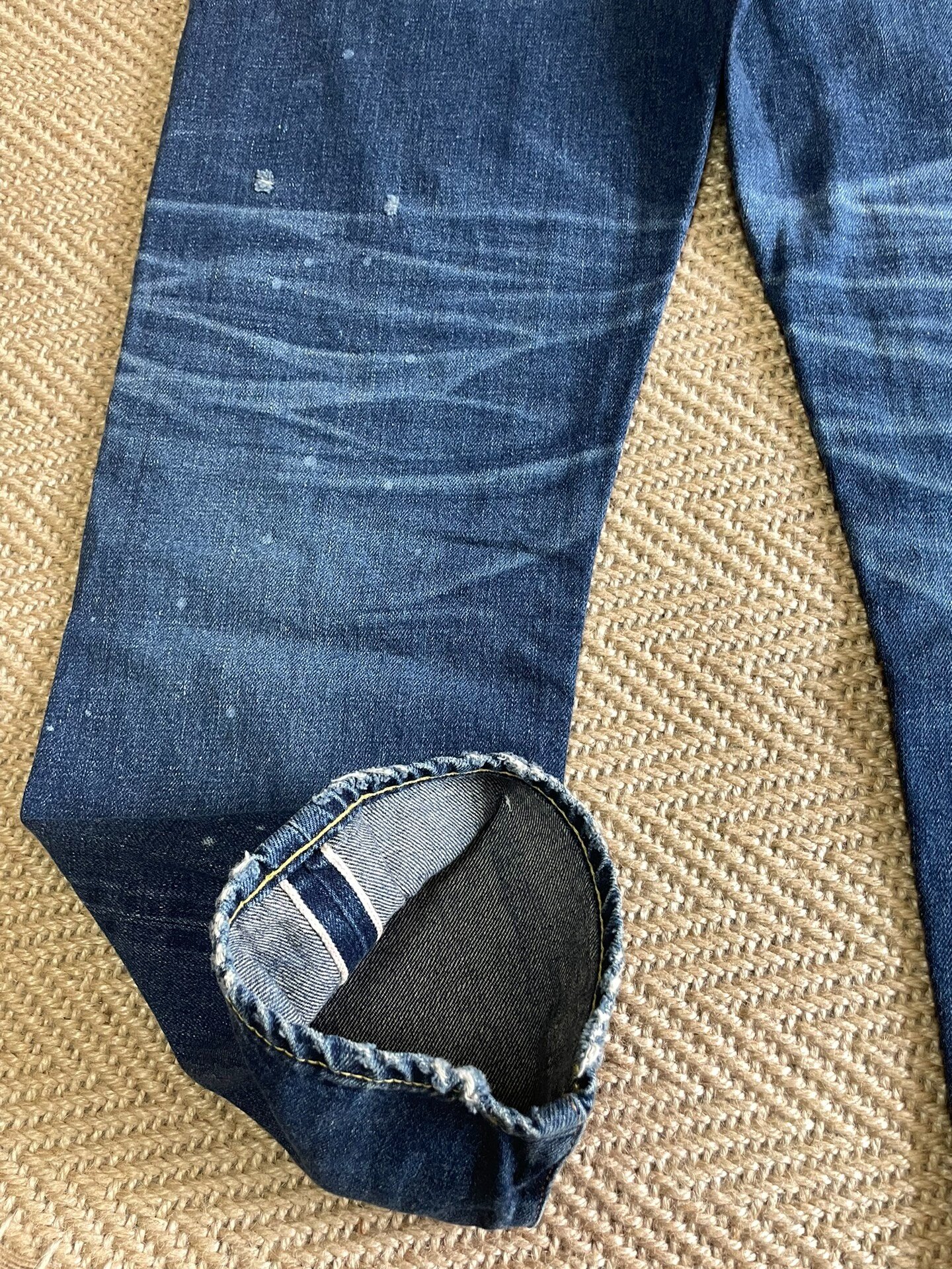 Vanquish Fragment Distressed Splatter Denim Jeans — label