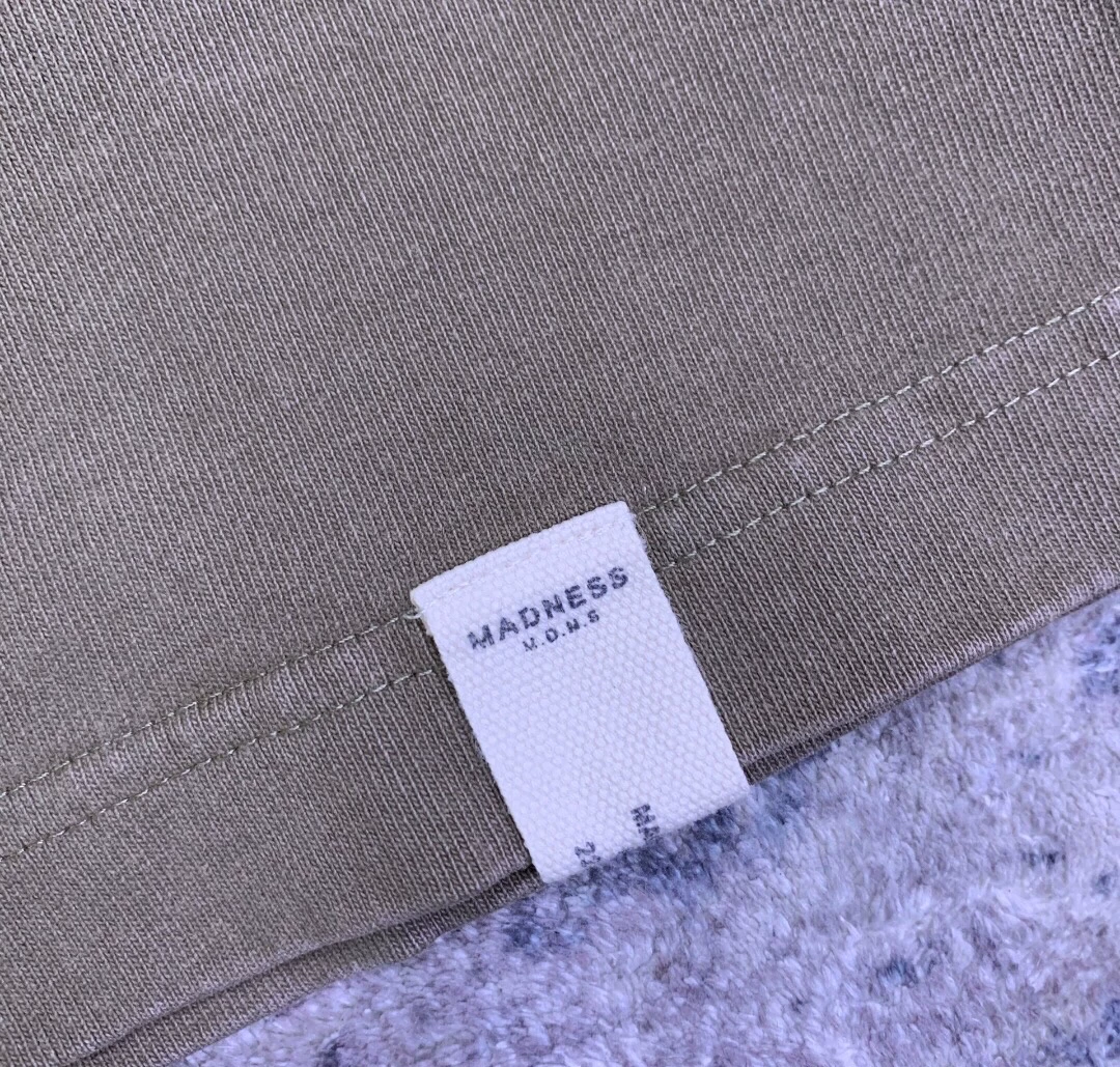 MADNESS Washed Stencil Long Sleeve Tee — label
