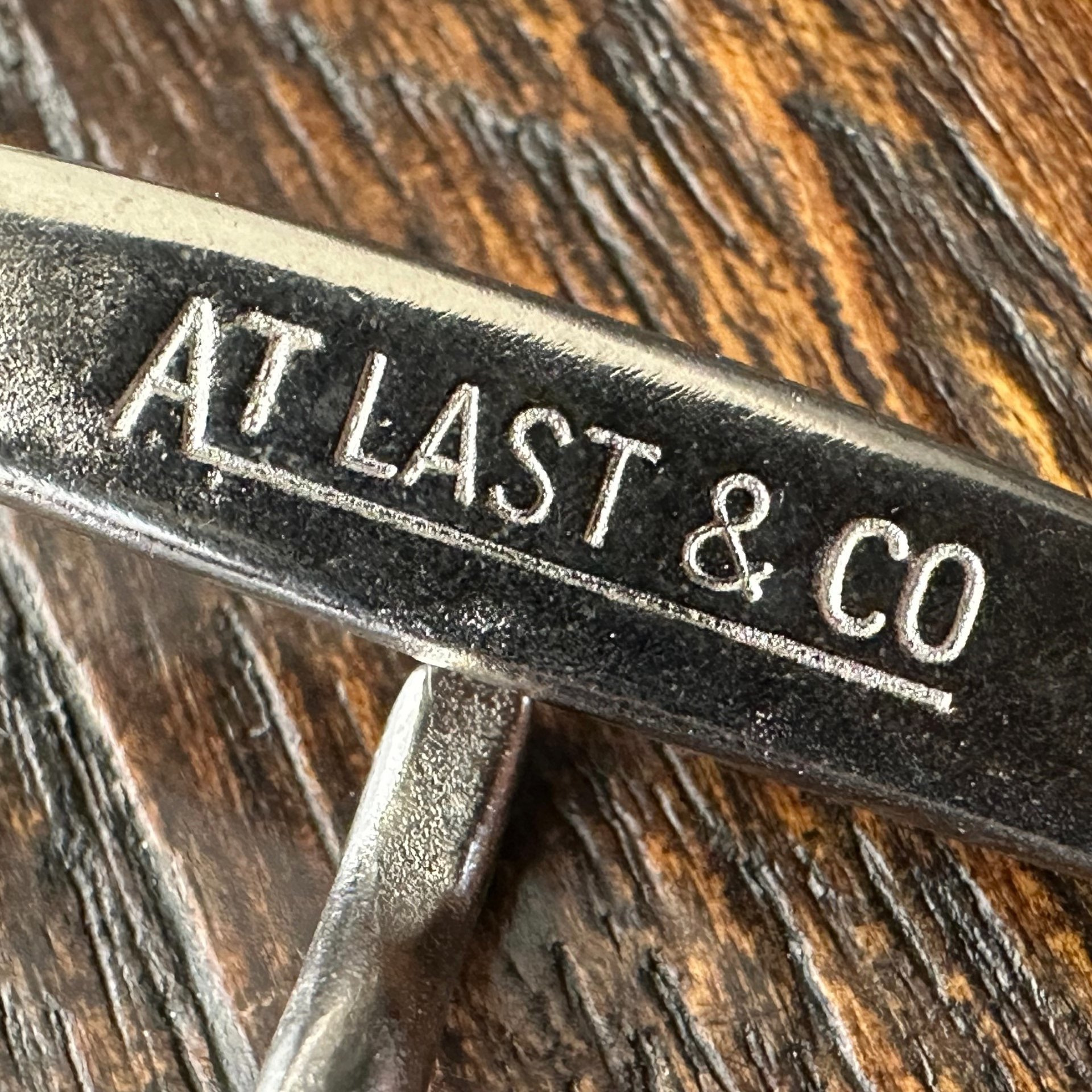 TWC Solid Brass Brown Belt — label