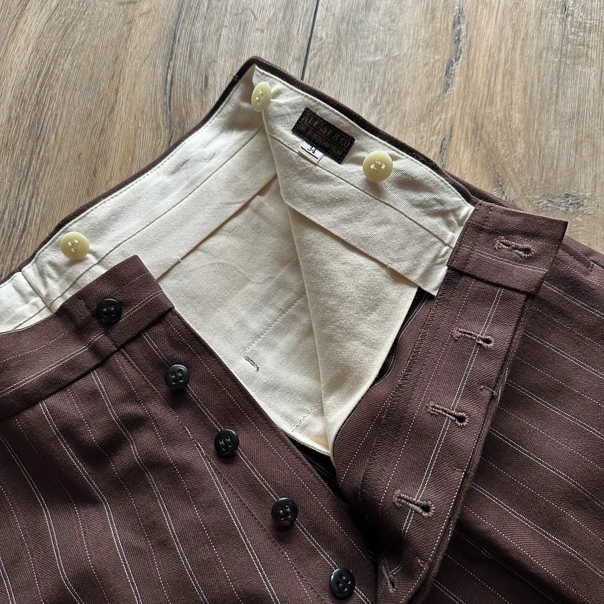 TWC Out-of-Print Brown Striped Pants — label