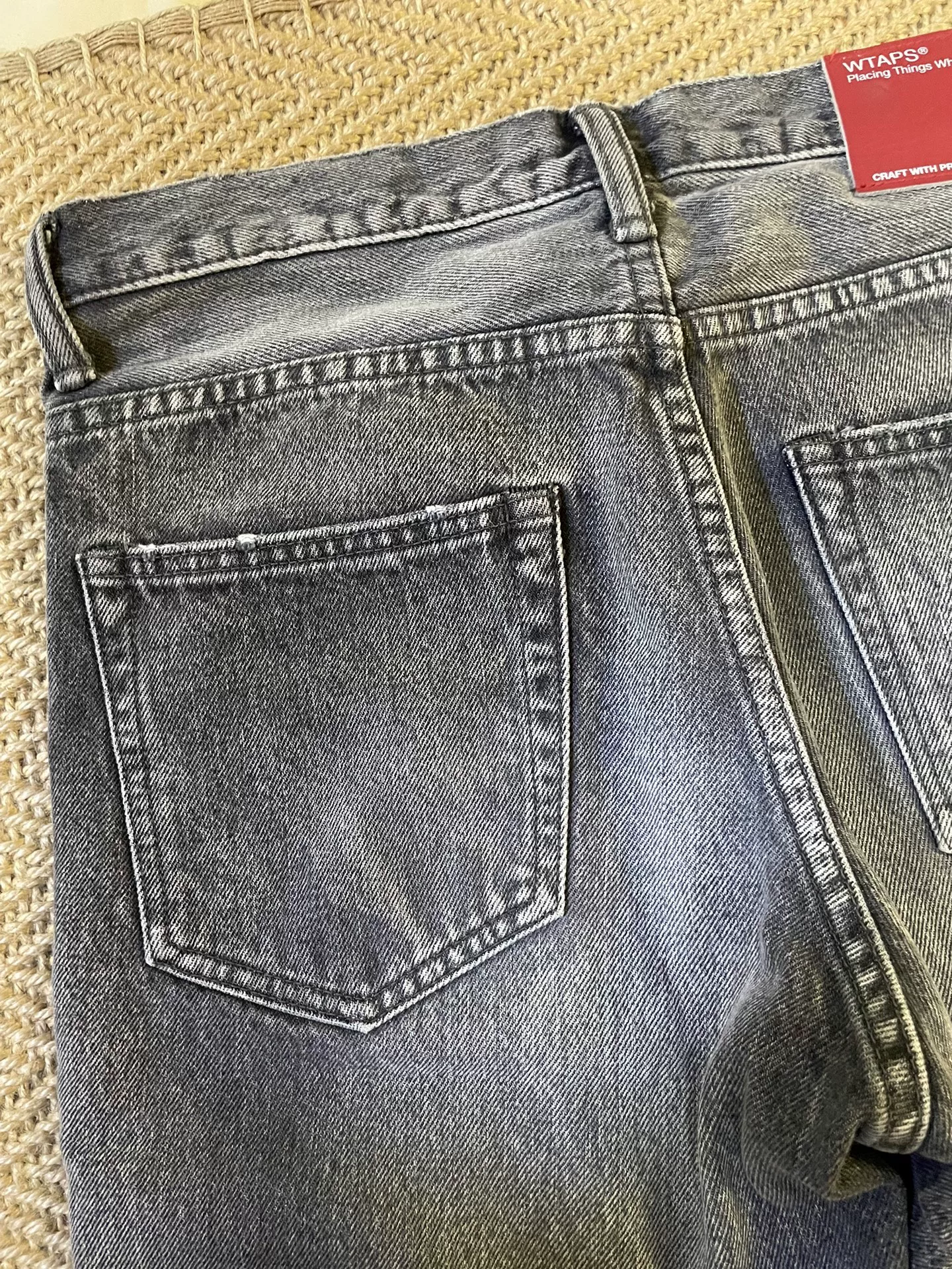 WTAPS Very Skinny Washed Jeans — label