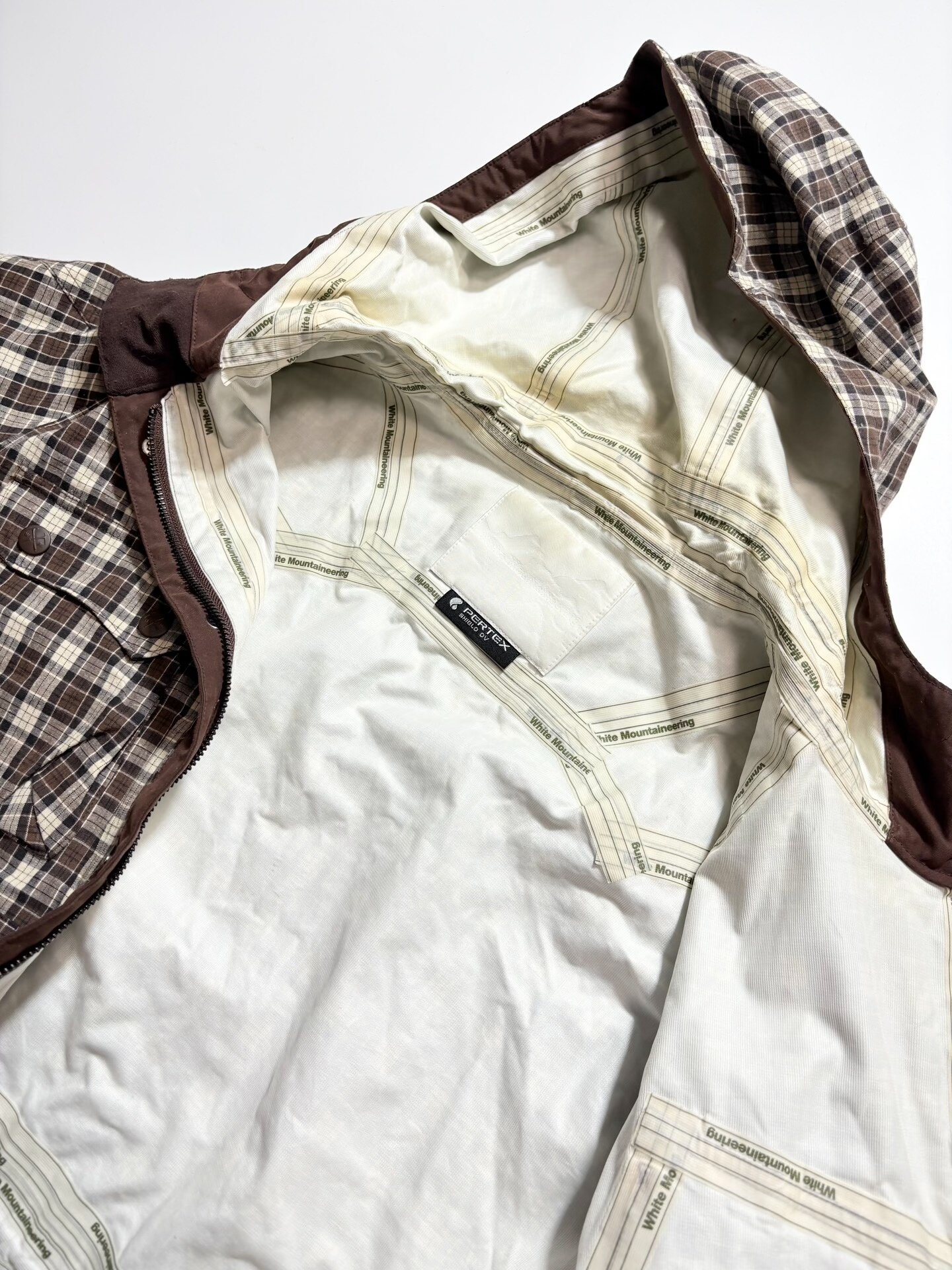 White Mountaineering Checkered Hooded Jacket — label