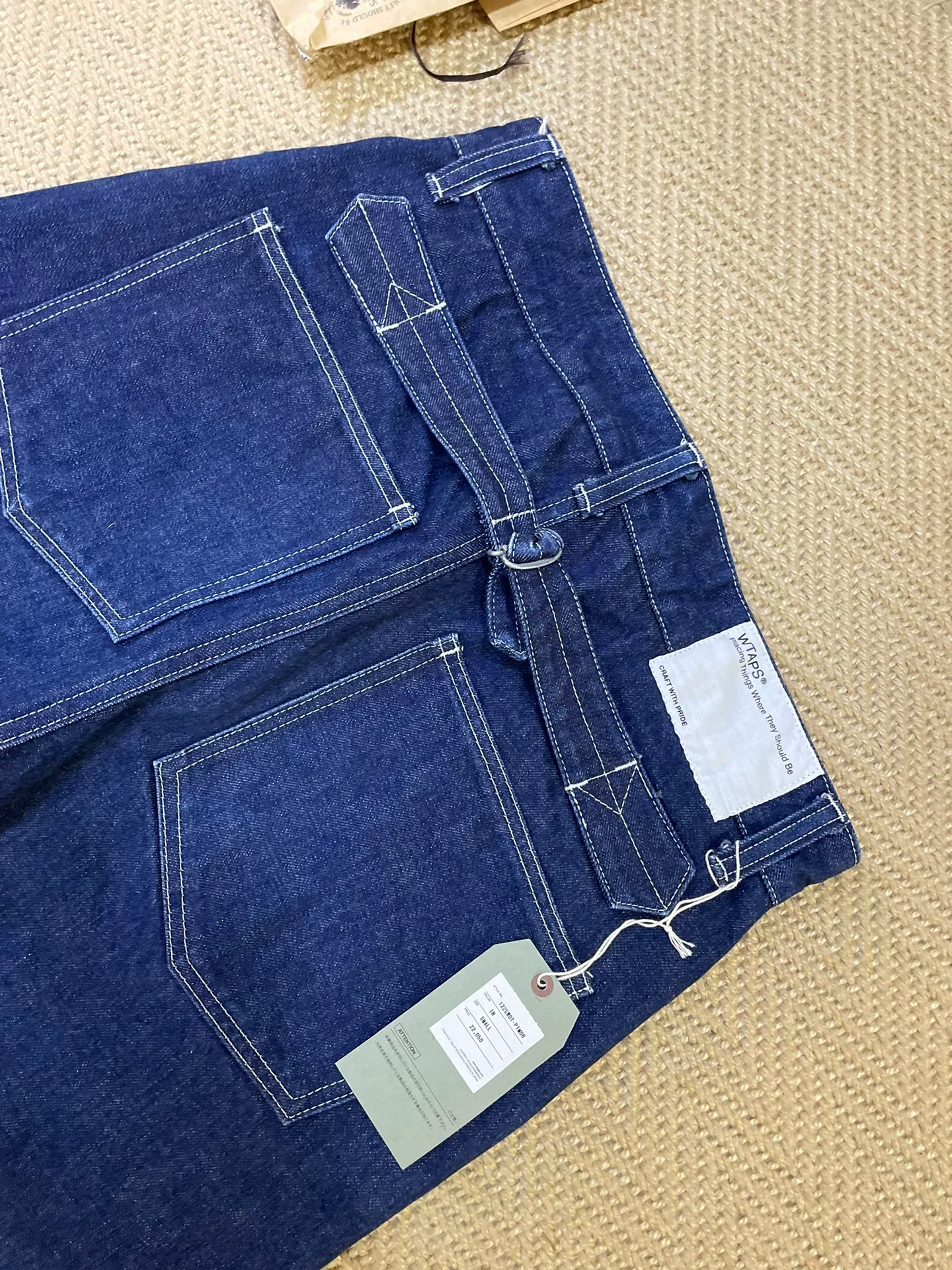 WTAPS UNION DENIM Raw Workwear Jeans — label