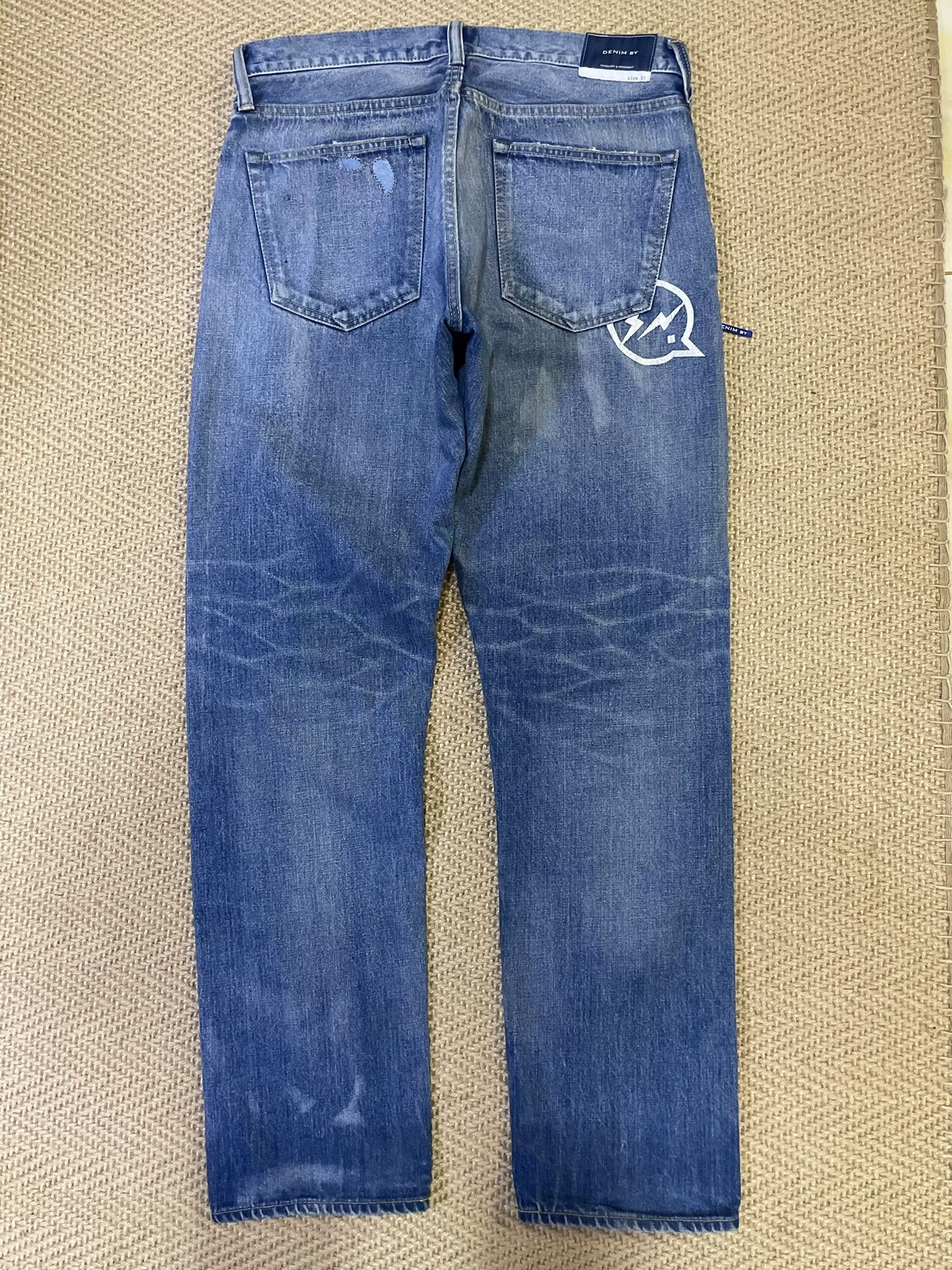 Vanquish Fragment Knife-Cut Washed Jeans — front