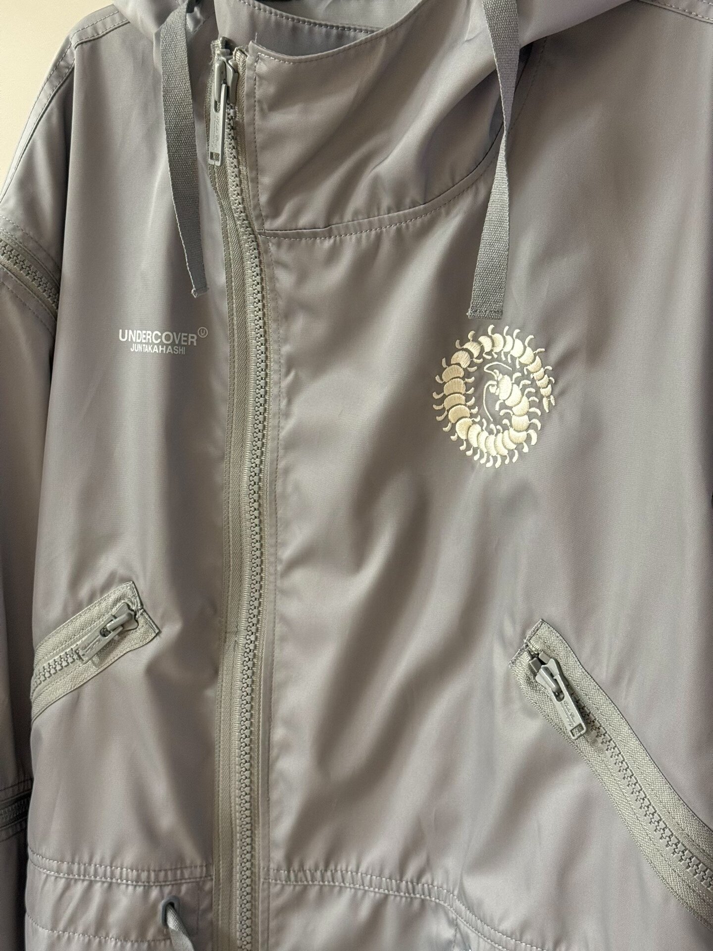 Undercover AW20 Fallen Man Fishtail Parka — detail