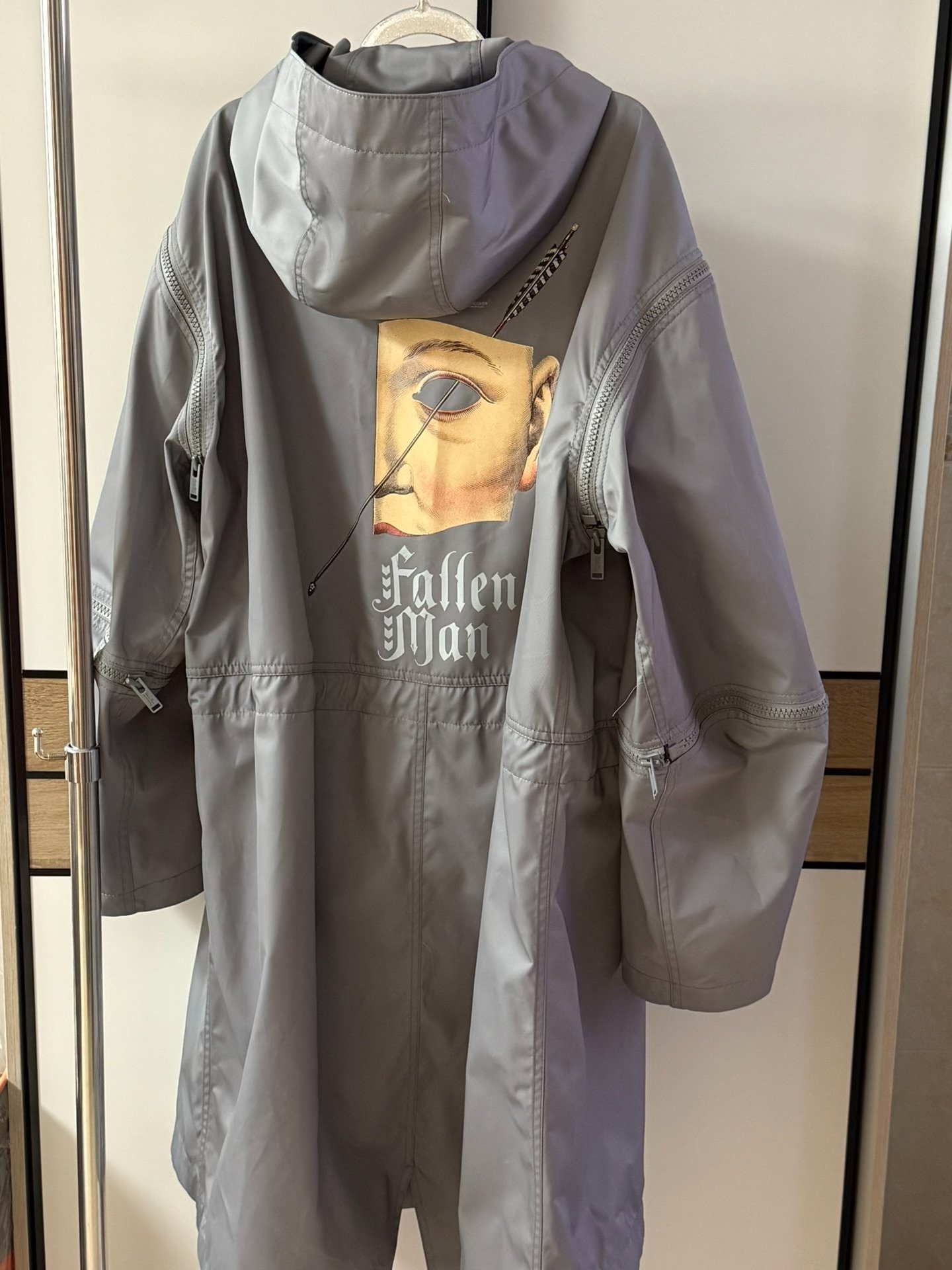 Undercover AW20 Fallen Man Fishtail Parka — label