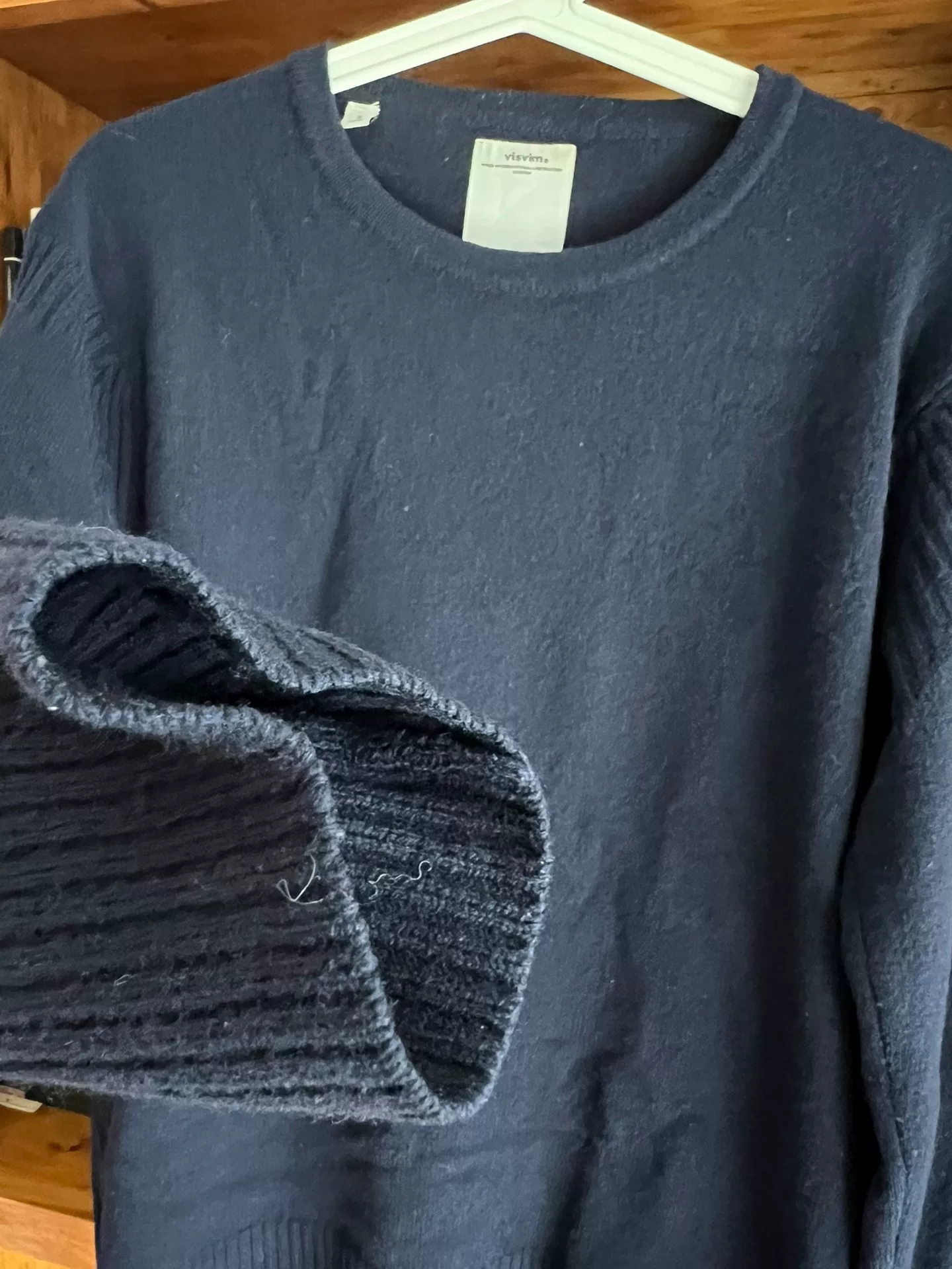visvim Isle Wool Crewneck Sweater — label