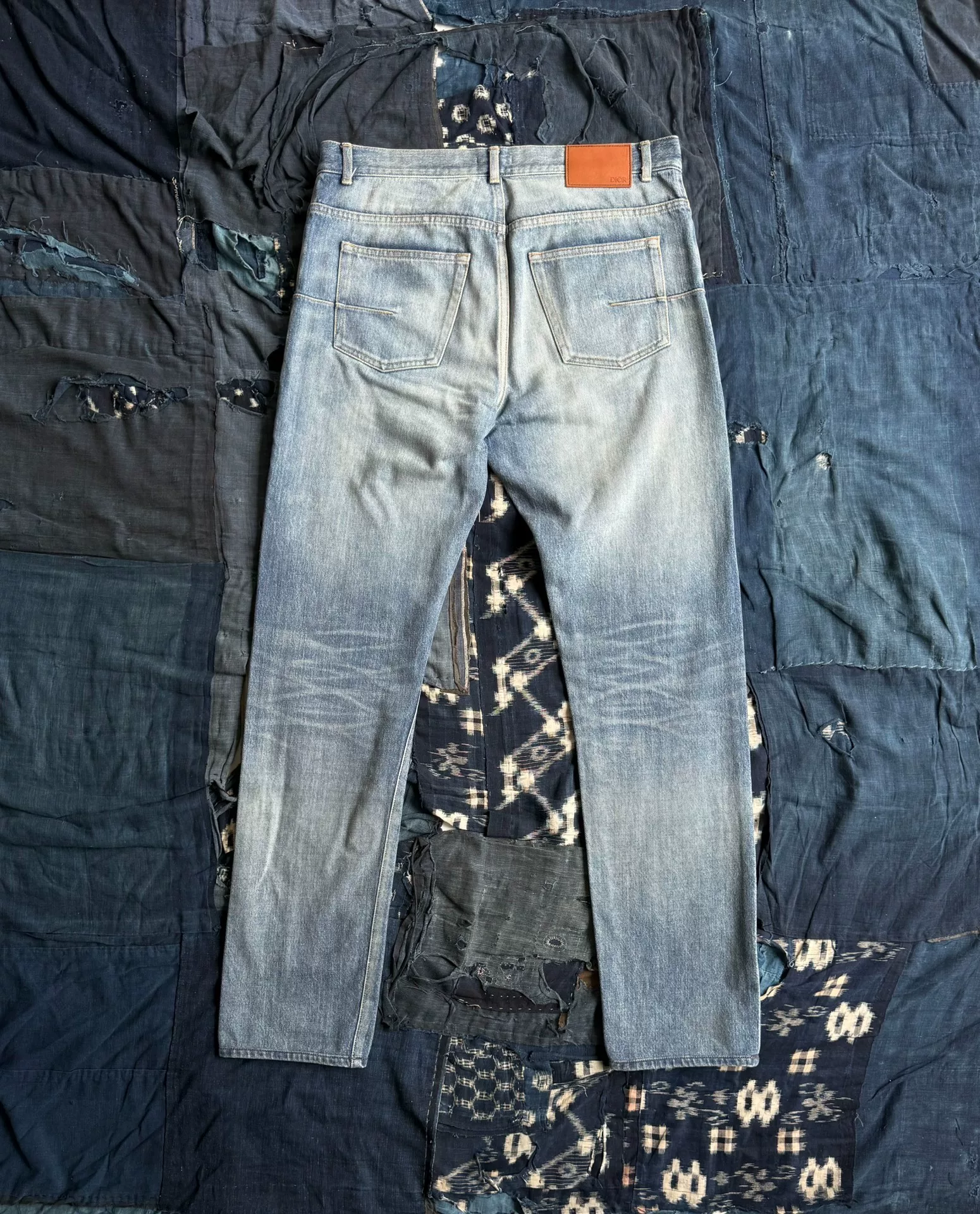 Dior Washed Distressed Straight Jeans — front