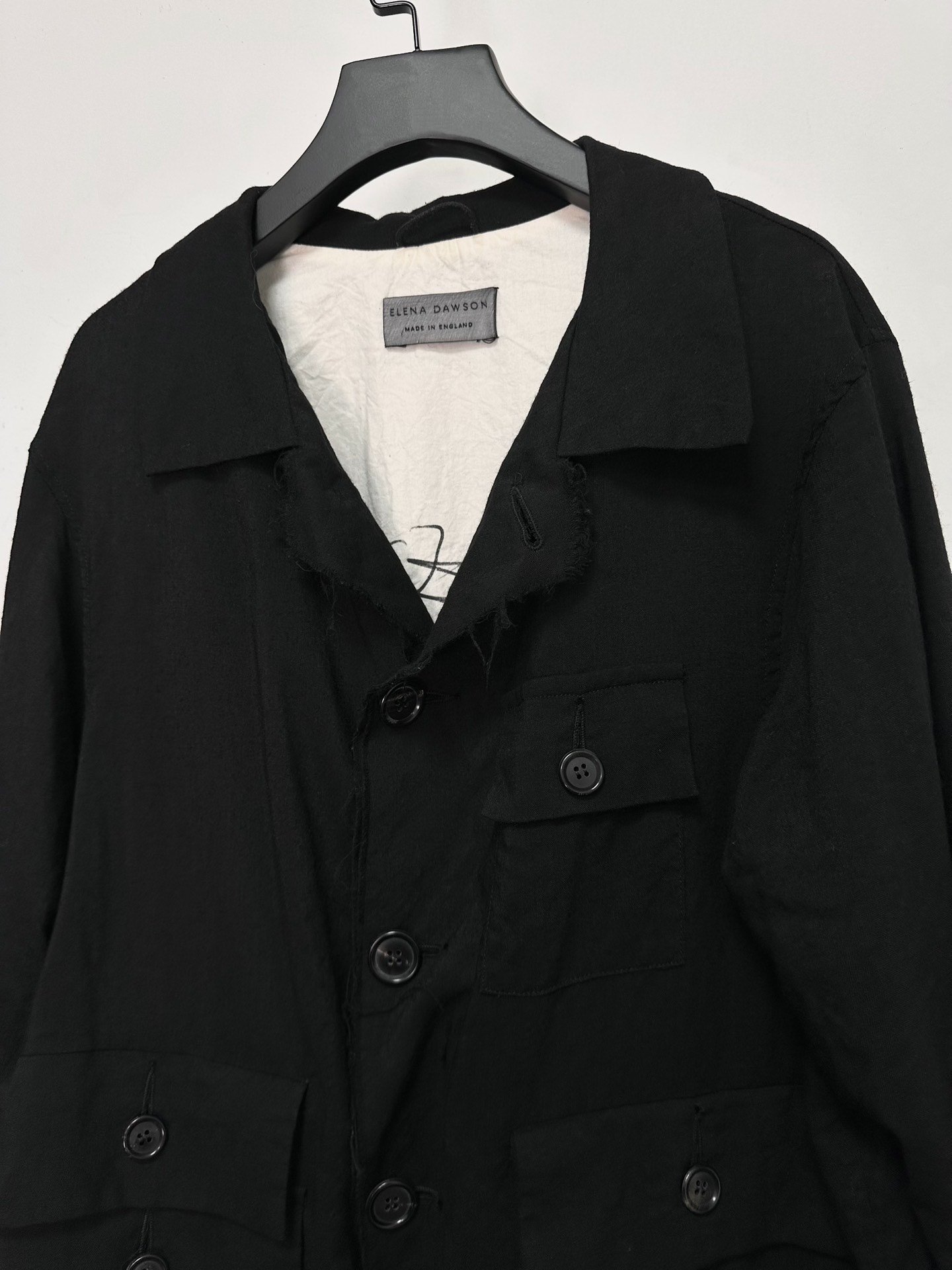 Elena Dawson Four-Button Ripped Jacket — label