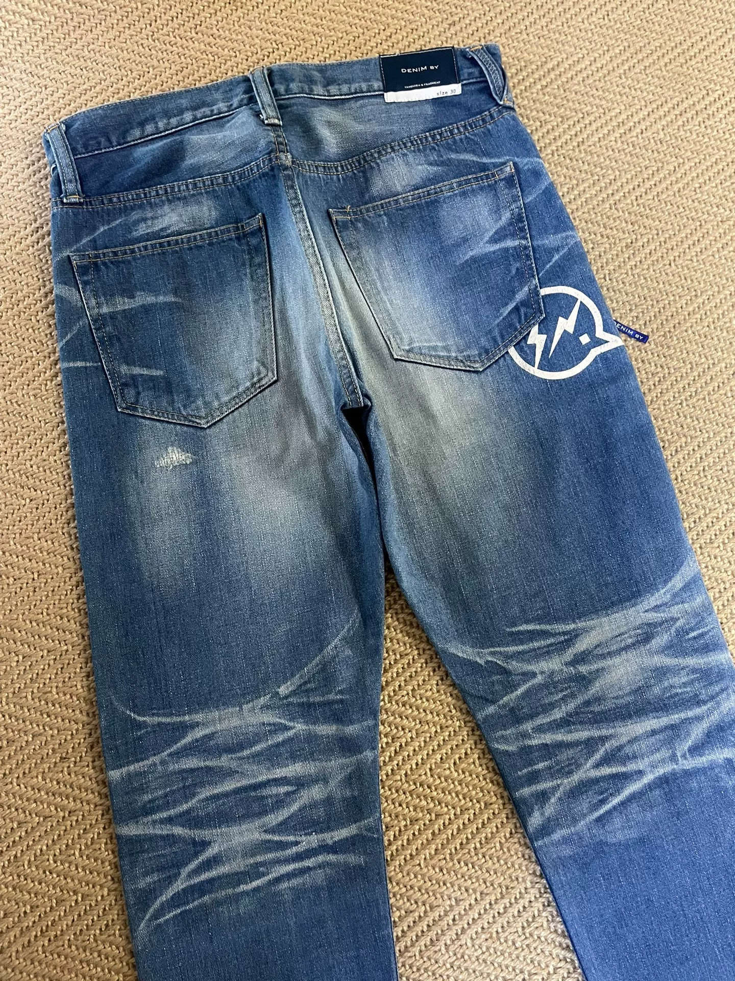 Vanquish Fragment Washed Distressed Cropped Jeans — label